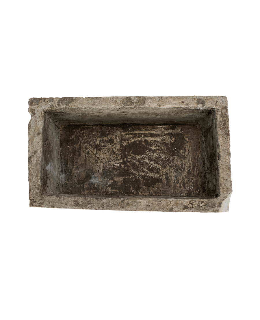 Vintage Indonesian rectangular limestone trough, top view showing weathered interior texture.