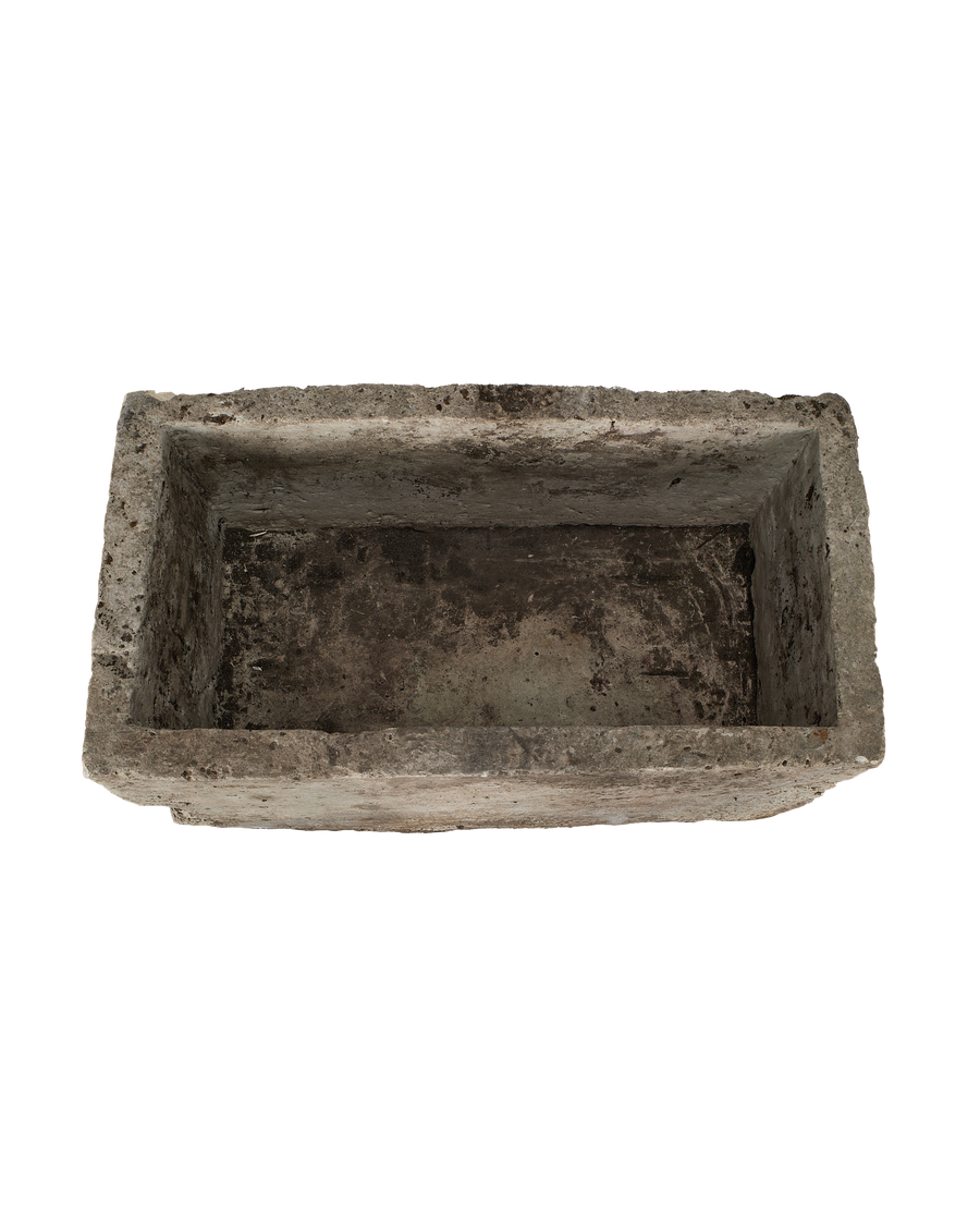 Vintage Indonesian limestone trough, top view showing weathered, rough textured interior.