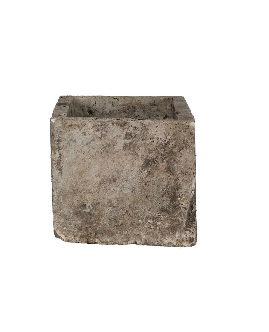 Vintage Indonesian rectangular limestone trough showing weathered light gray exterior and dark interior.