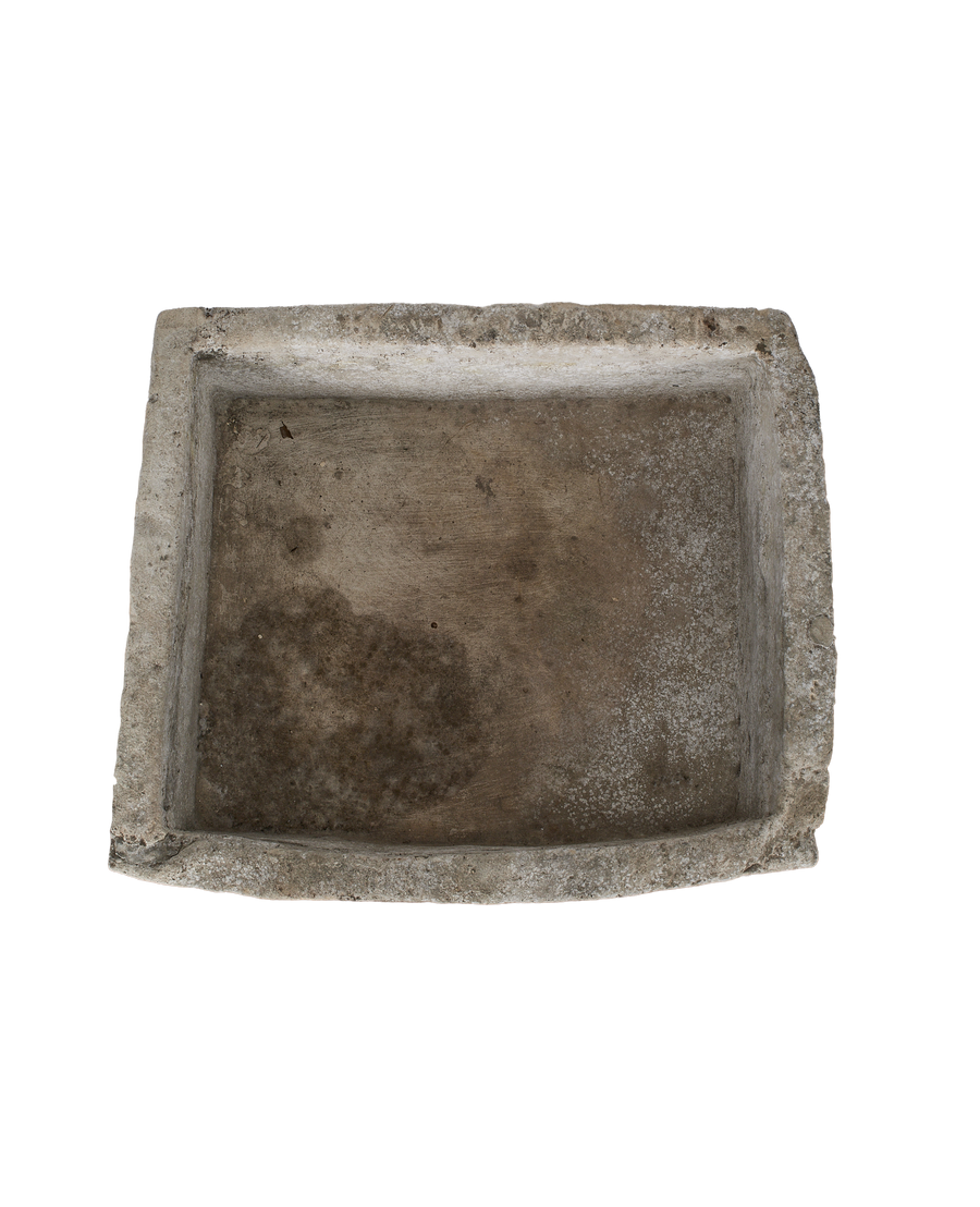 Vintage Indonesian limestone rectangle trough, top-down view showing interior erosion and unique rounded side.