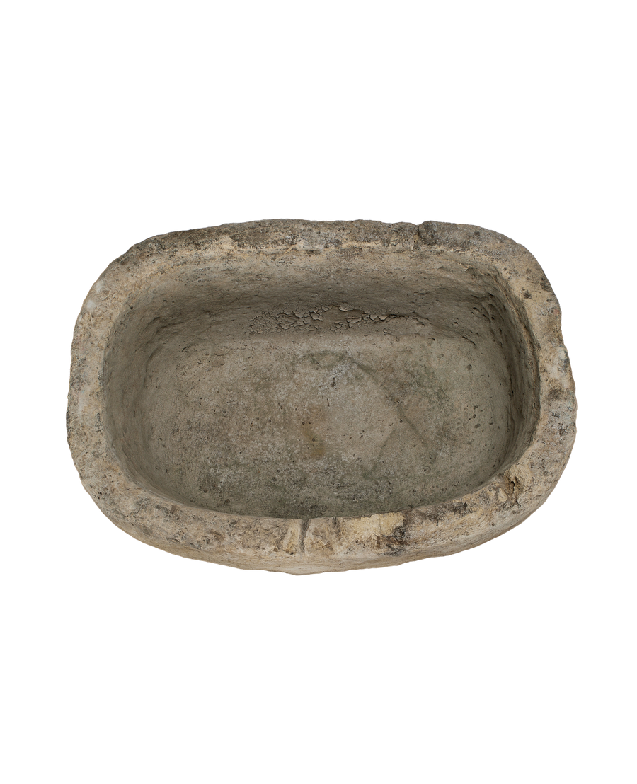 Oblong vintage Indonesian limestone trough, top-down view showing interior texture and condition.