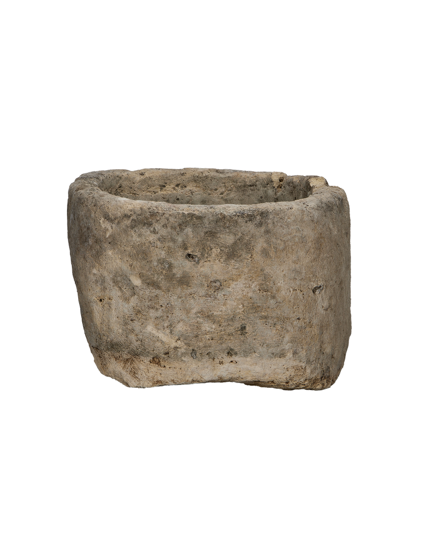 Vintage oblong limestone trough, front view showing weathered texture and natural imperfections.