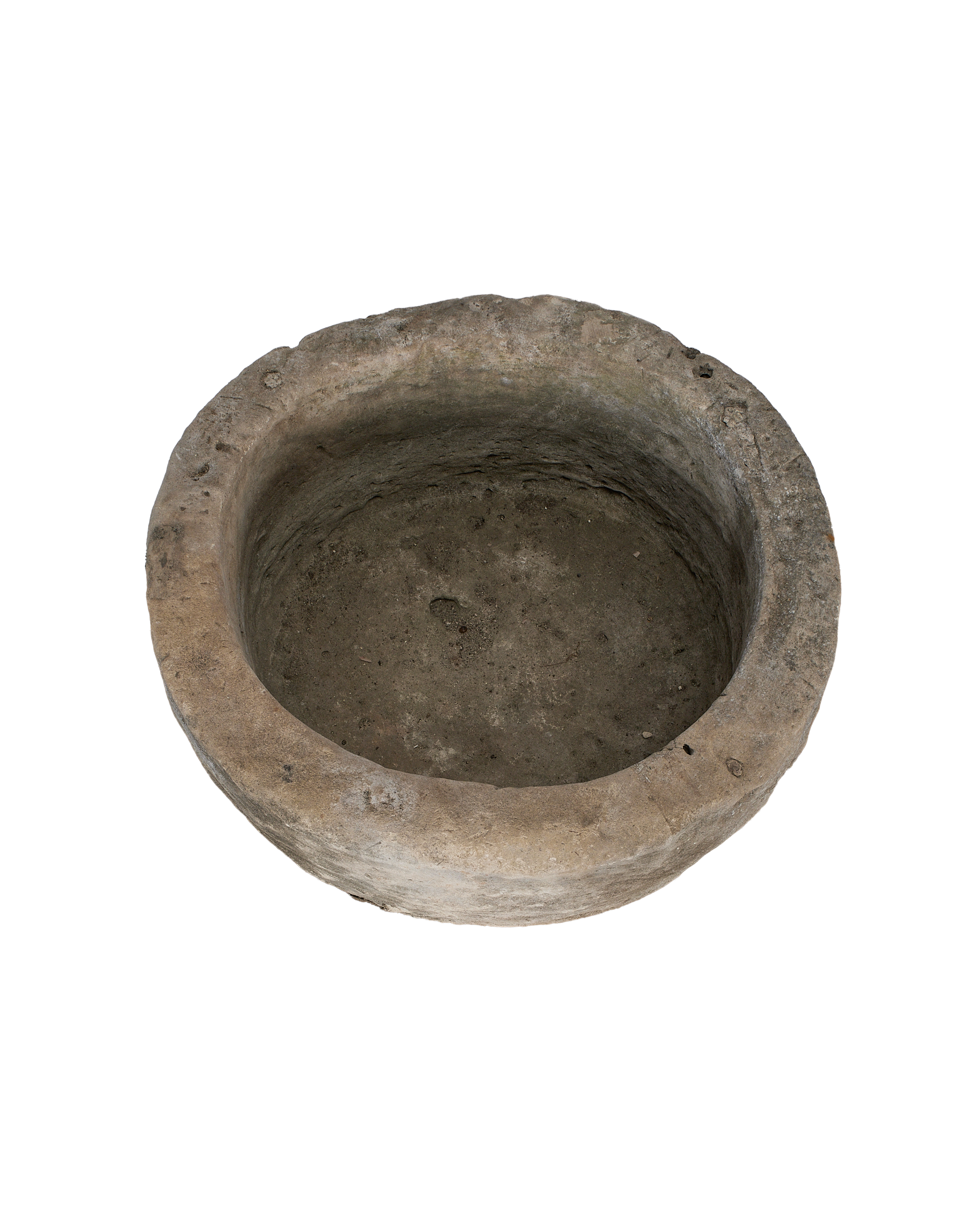Vintage Indonesian carved limestone round trough, showing worn interior and weathered rim.