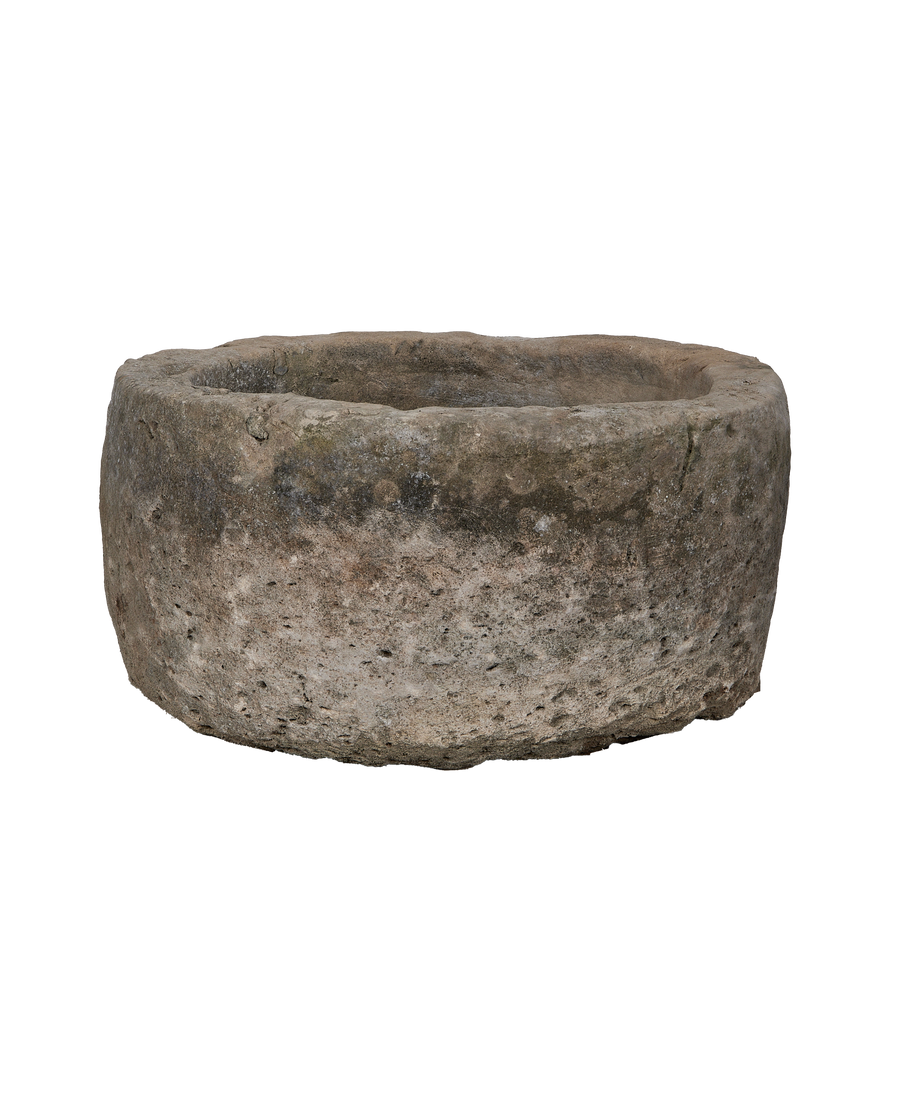 Vintage Indonesian limestone trough, round, showing detailed weathered surface texture.
