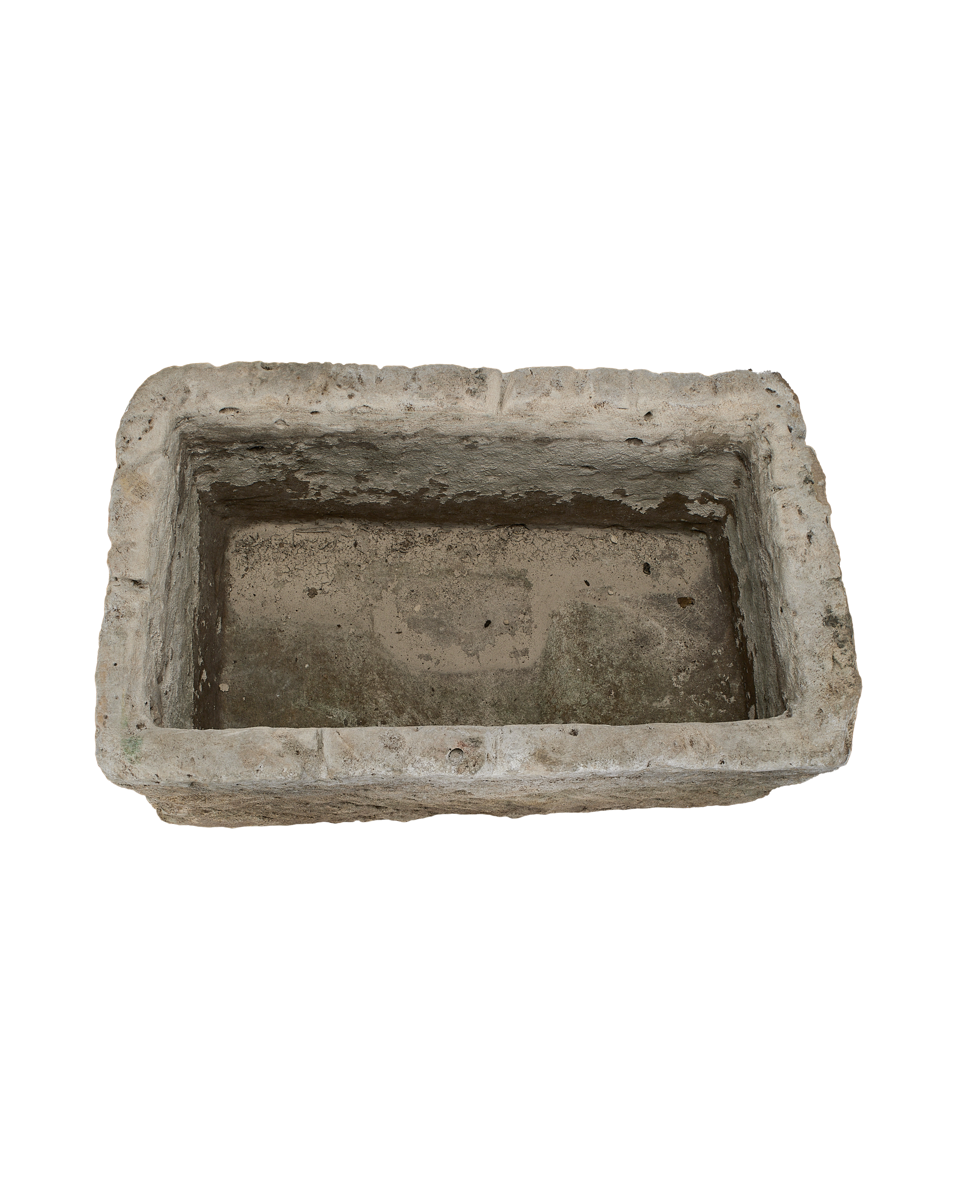 Vintage Indonesian limestone trough, top-down view showing interior depth and rough texture.