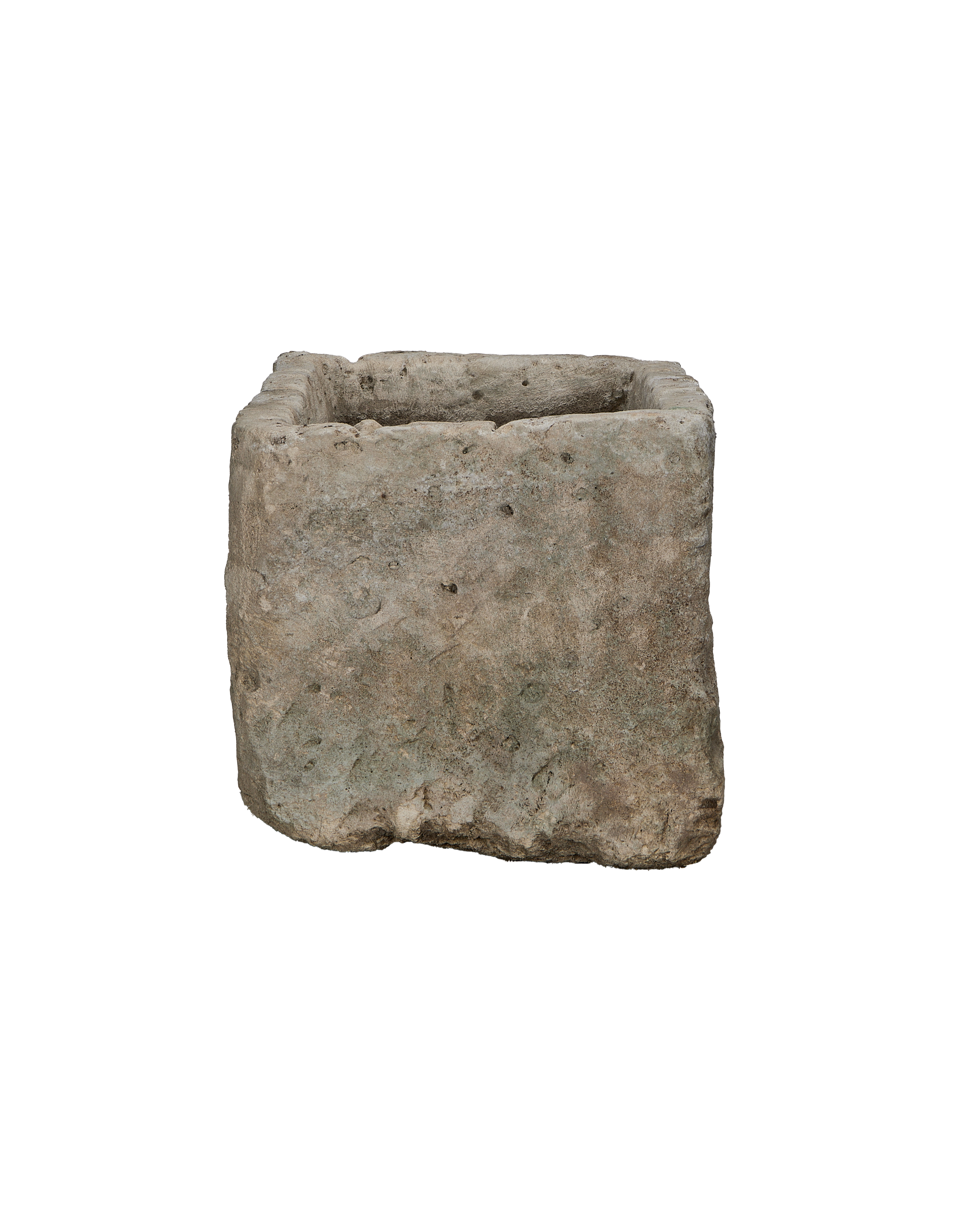 Vintage Indonesian limestone trough viewed from an unadorned, textured side, highlighting natural wear.
