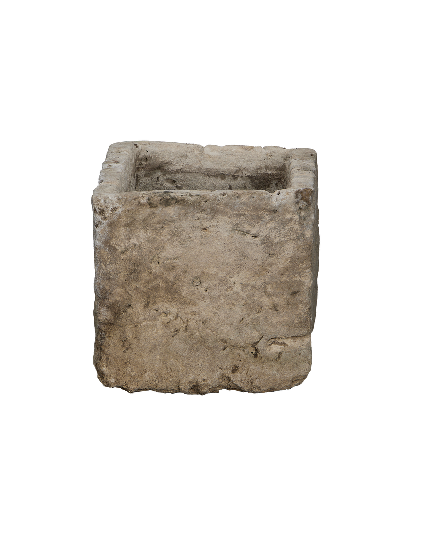 Vintage Indonesian rectangular limestone trough, bottom corner showing weathered stone texture.