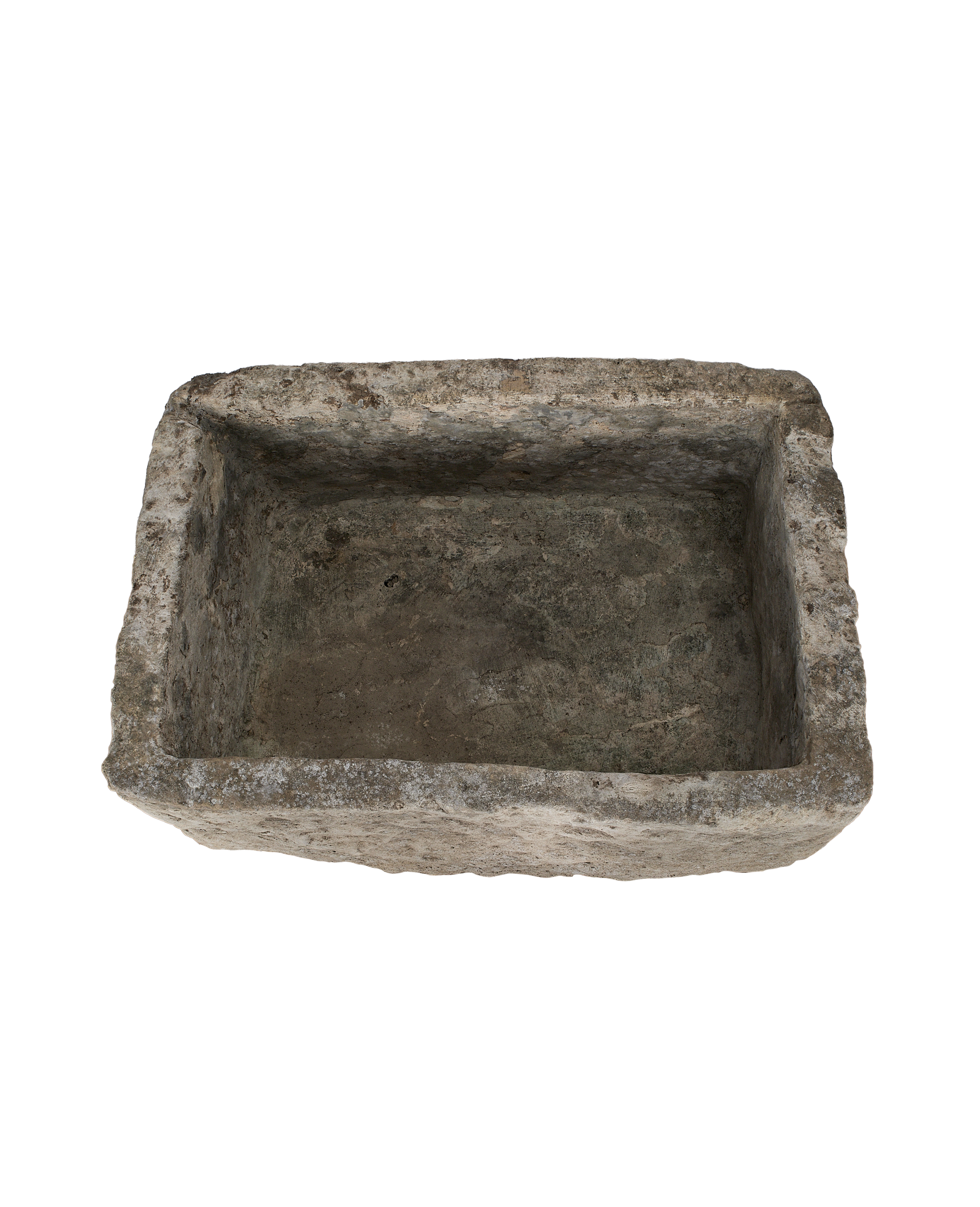 Top-down view of the vintage limestone trough's rectangular interior with rustic patina.
