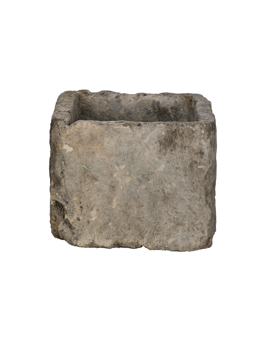 Vintage gray rectangular limestone trough, rustic texture, top view showing weathered interior.