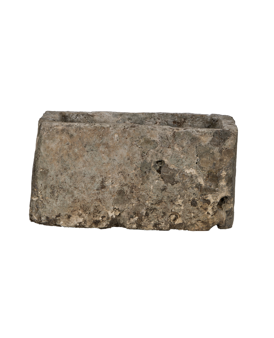 Rectangular vintage Indonesian limestone trough, showcasing rustic weathered texture, moss, and unique surface imperfections.