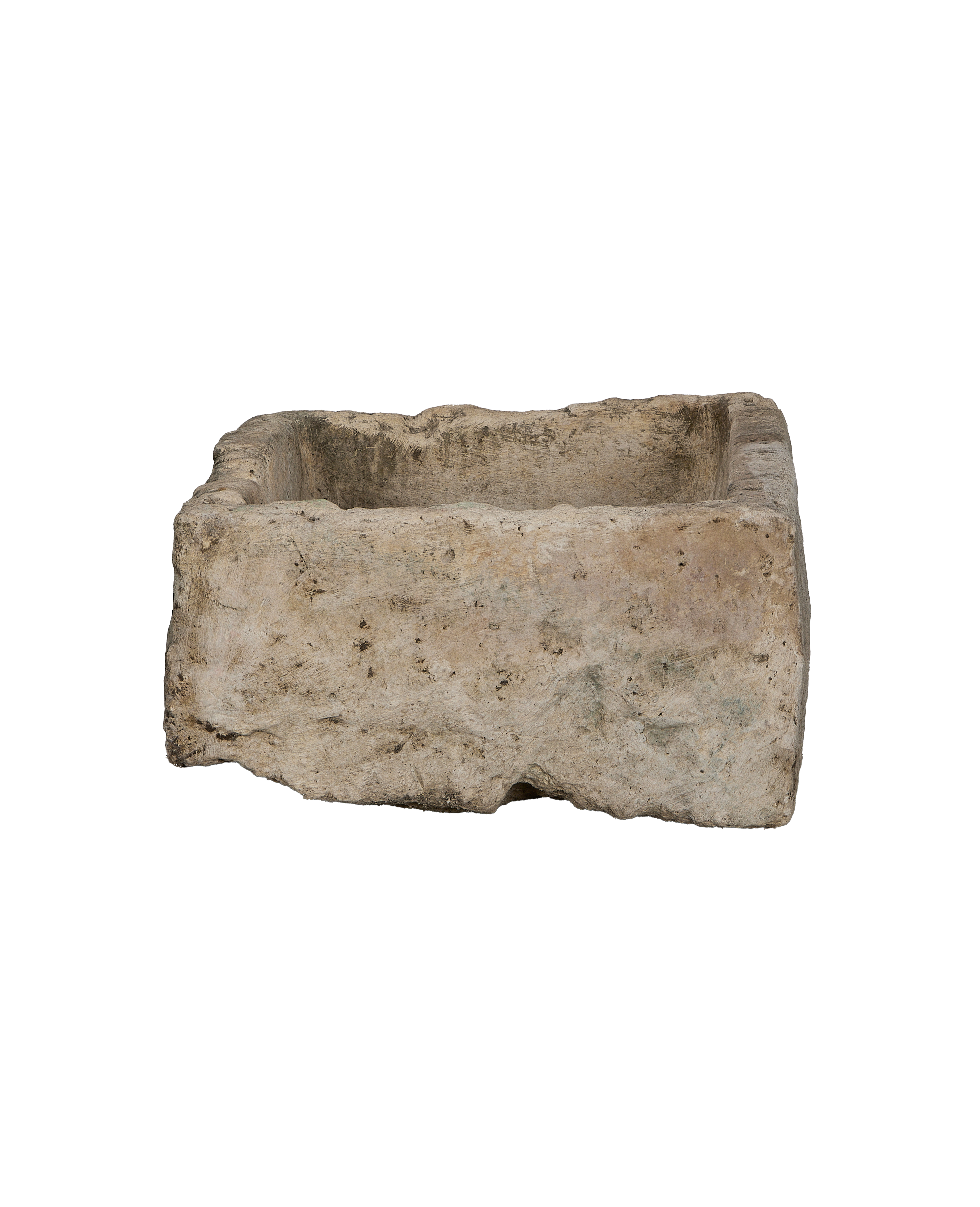 Vintage Indonesian limestone trough showcasing rough, weathered texture and natural imperfections from a side angle.