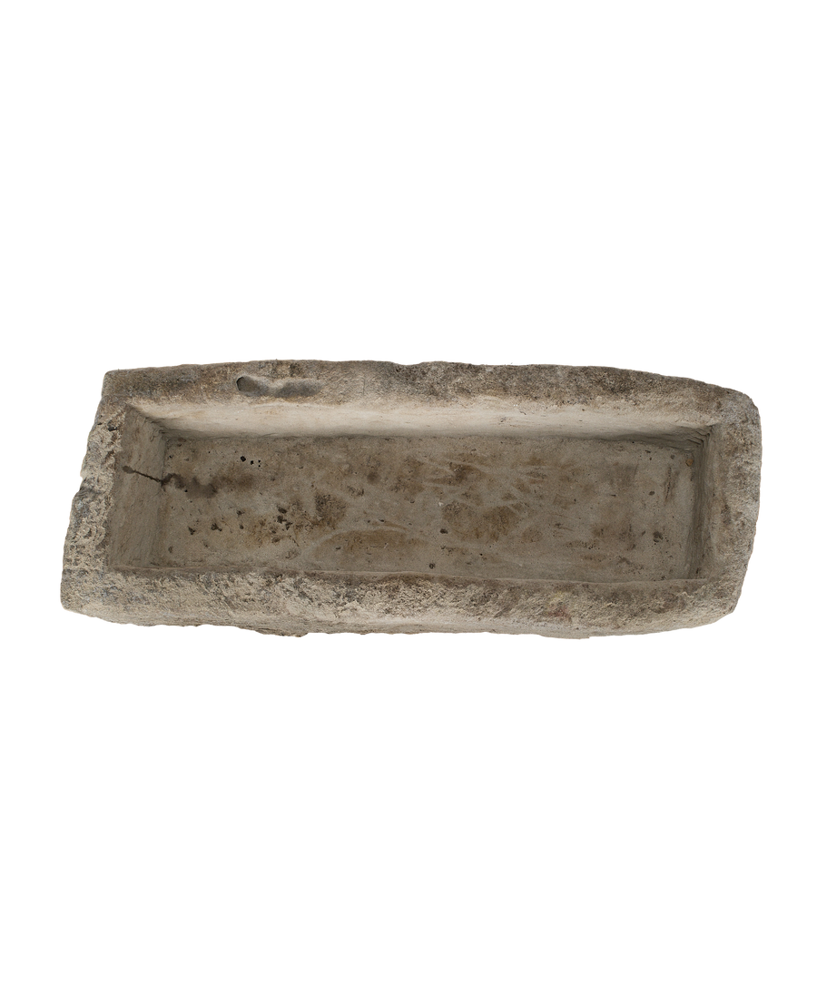 Vintage Indonesian limestone trough (OAK), overhead view showing rectangular interior and weathered texture.