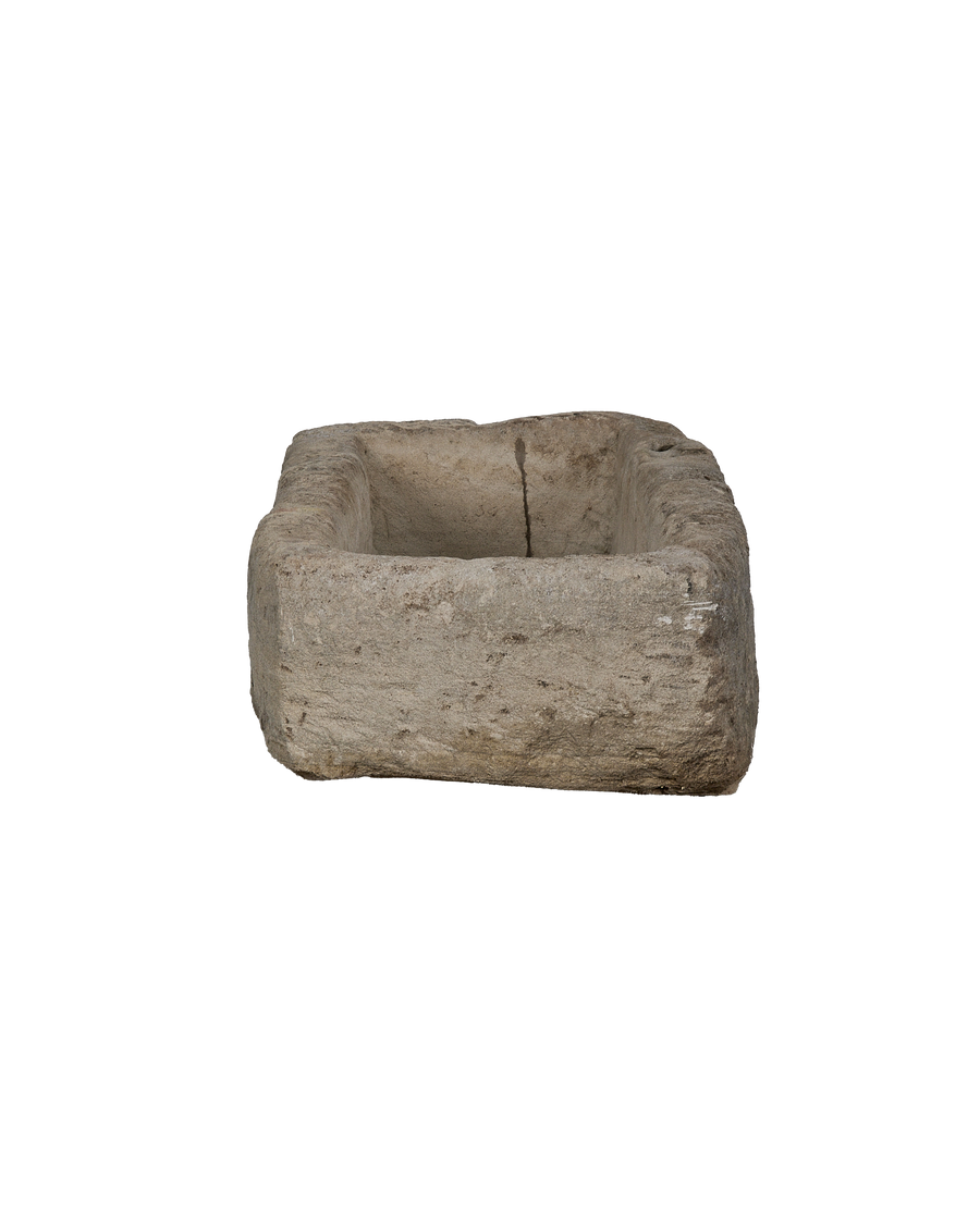 Vintage Indonesian limestone trough viewed from above, showcasing rustic texture and aged condition.