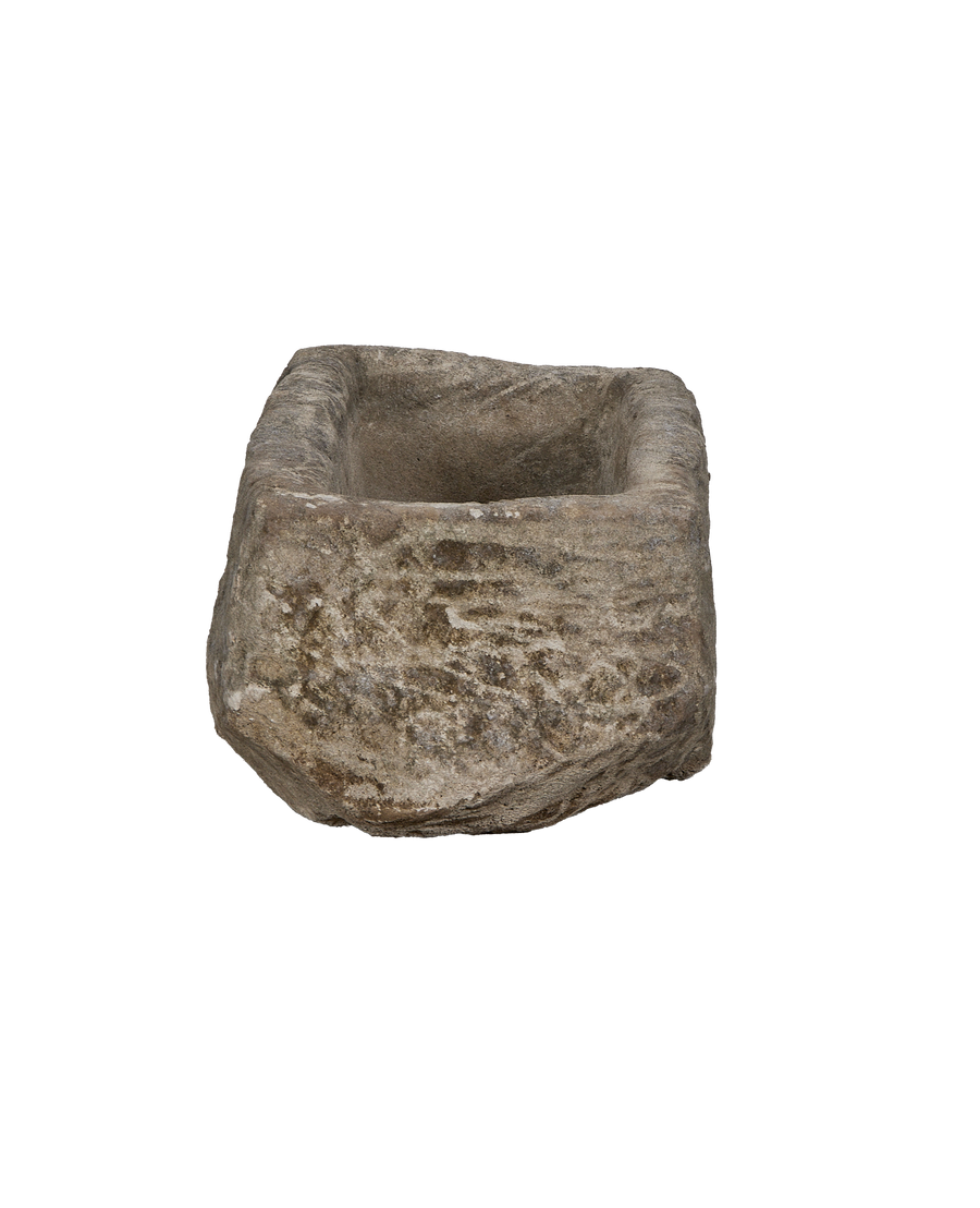 Vintage rectangular limestone trough, showing the rough, weathered texture and eroded surface details.