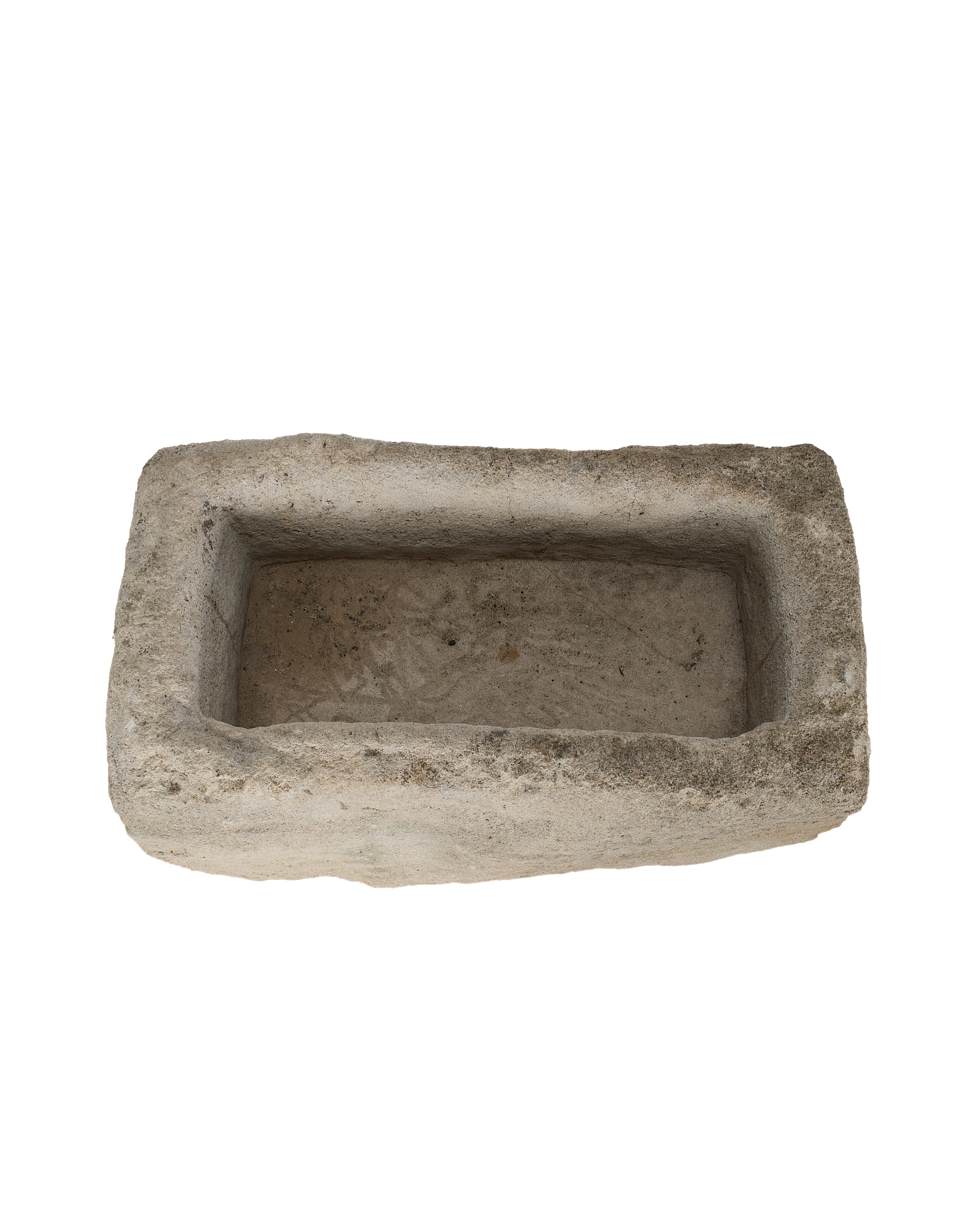 Vintage rectangular limestone trough, top-down view highlighting the rough, weathered interior surface.