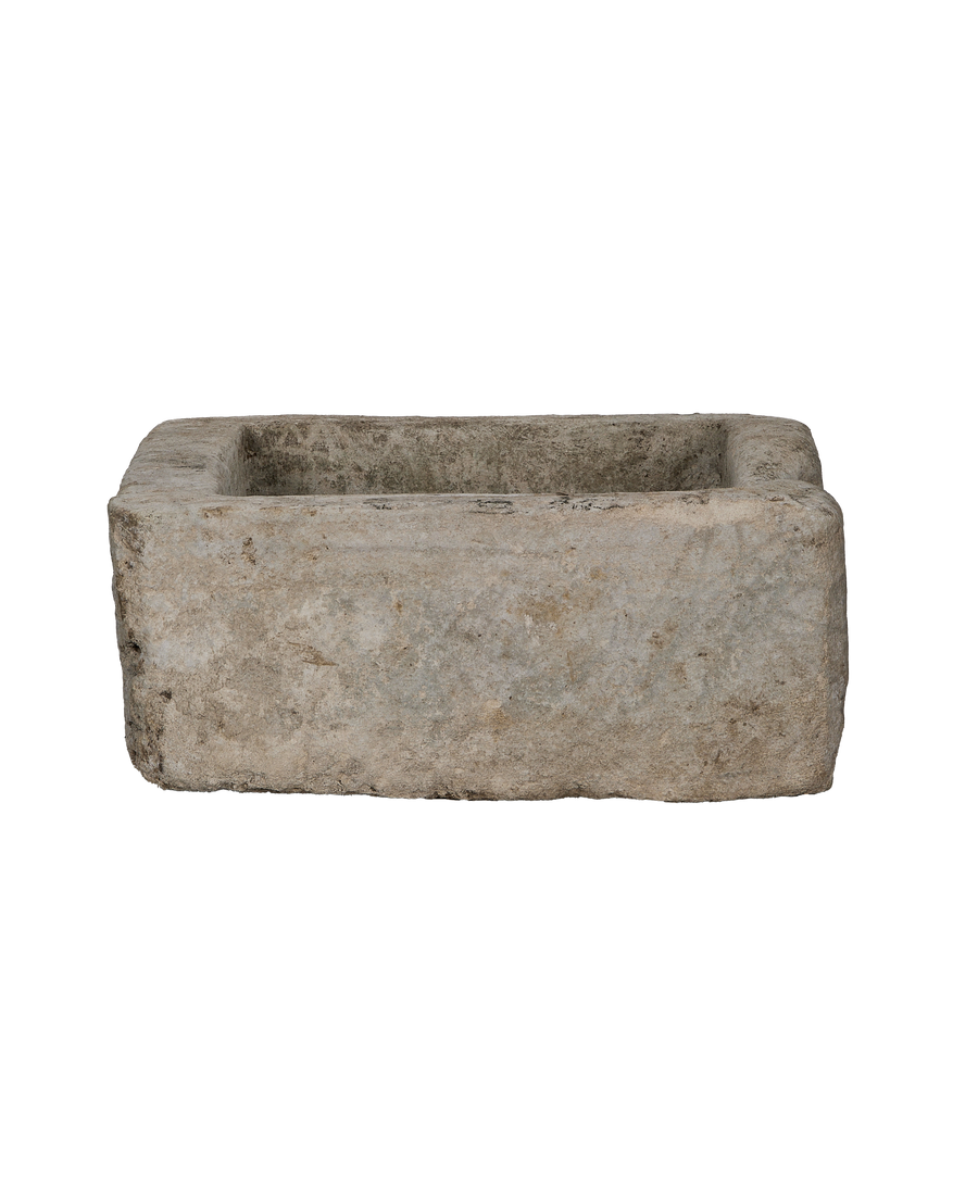 Vintage Indonesian limestone trough (Oak), rectangular, showing the rough, weathered exterior texture.