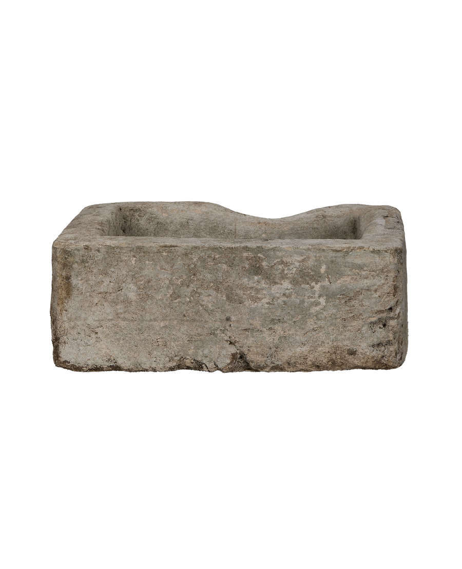 Vintage Indonesian rectangular limestone trough showing wavy inner rim and rustic texture.