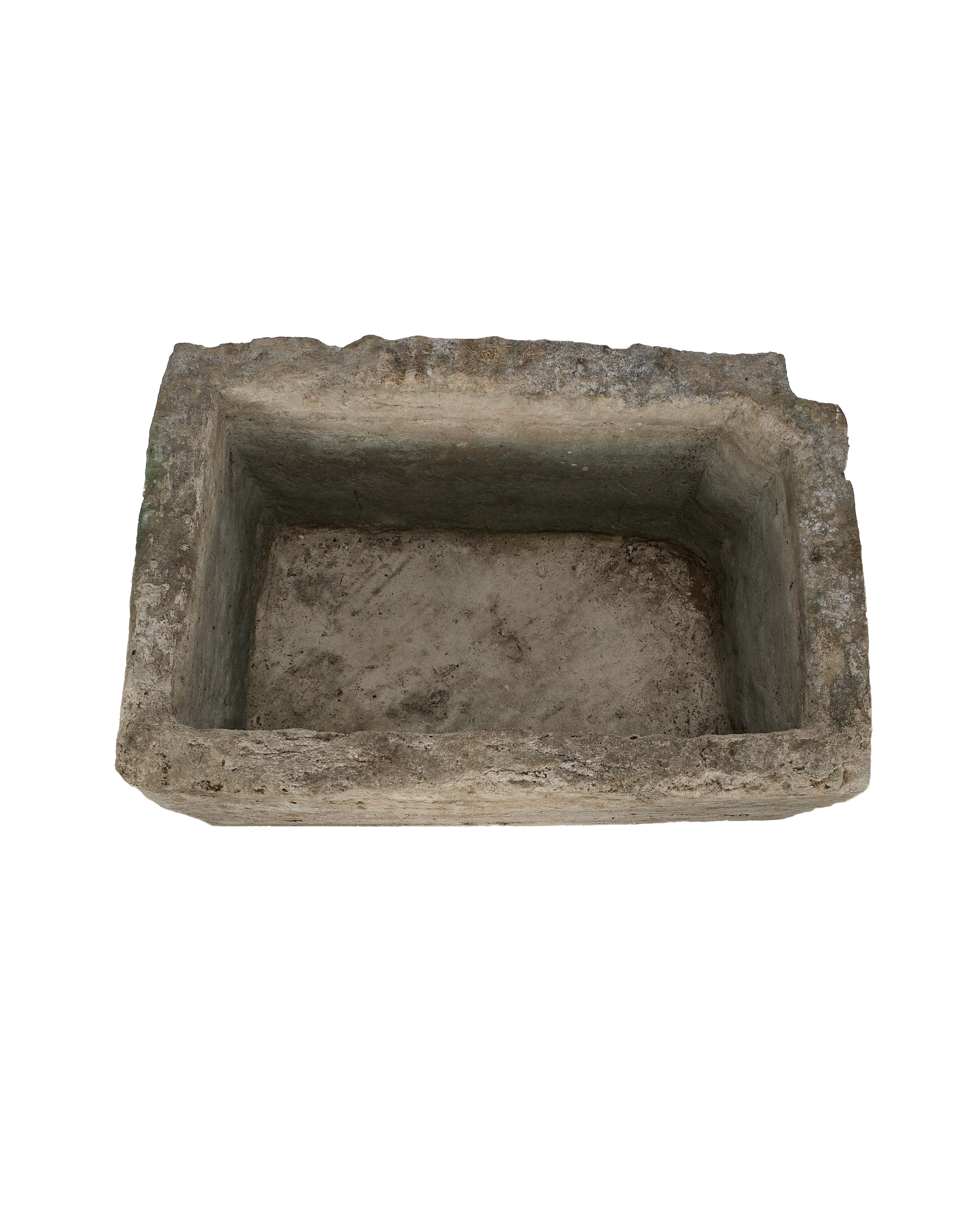 Vintage rectangular limestone trough, showing the weathered texture and rough-hewn interior from a top-down angle.