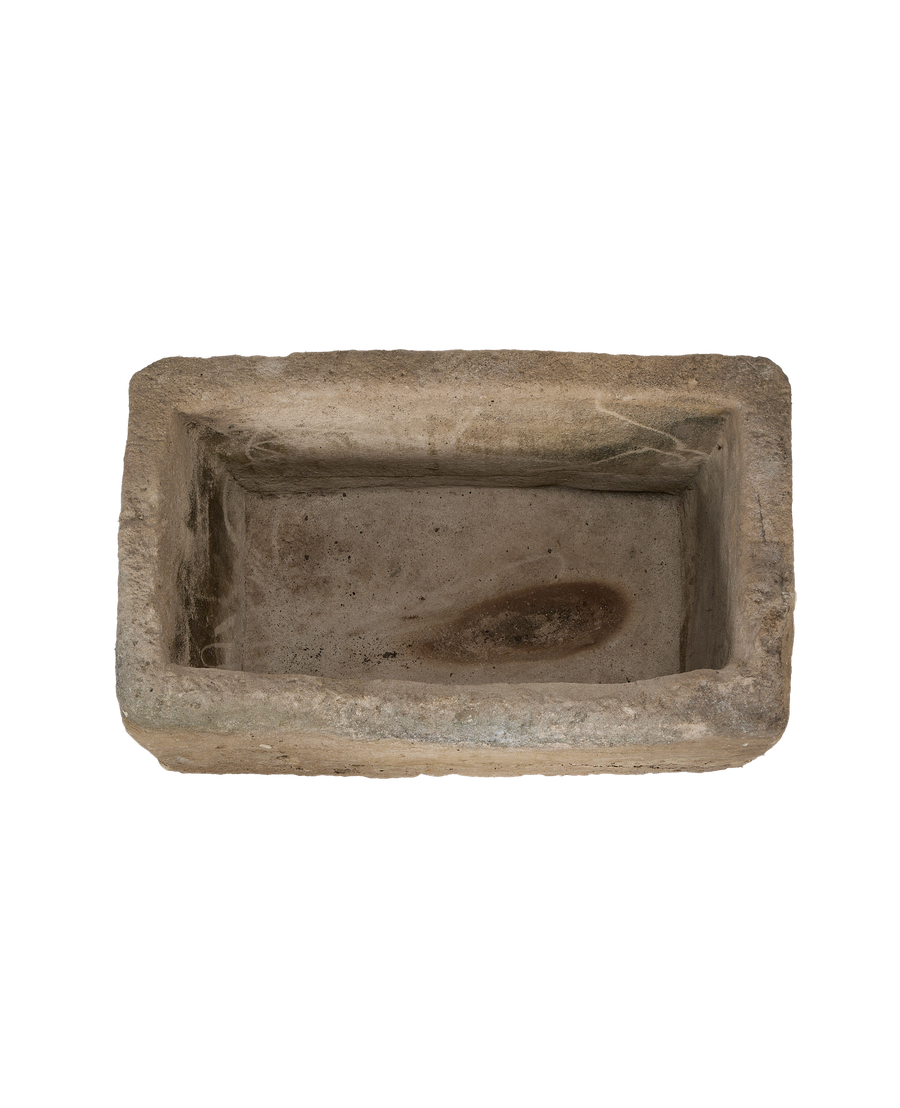 Vintage rectangular limestone trough, top view with unique interior surface patination and character.