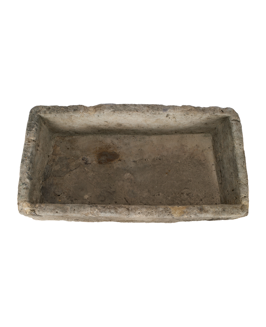 Vintage Indonesian limestone trough, top view of rectangular opening with weathered texture.