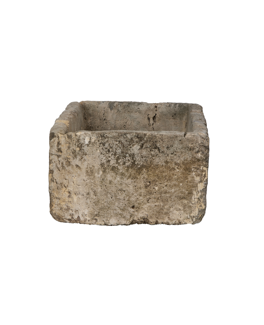 Vintage Indonesian rectangular limestone trough showing full front and distressed texture.