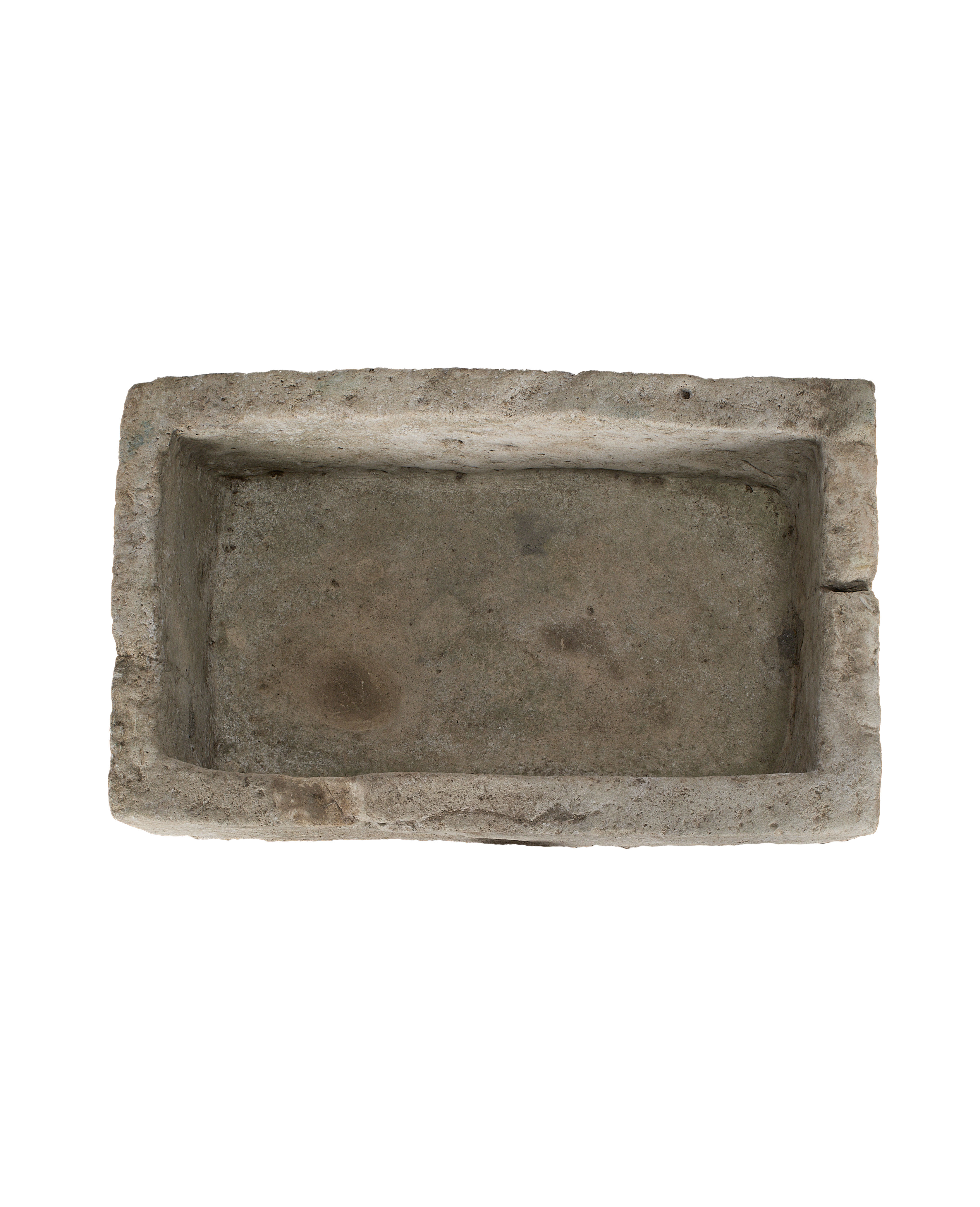 Vintage Indonesian limestone trough closeup, featuring rough-hewn rectangular edges and weathered interior.