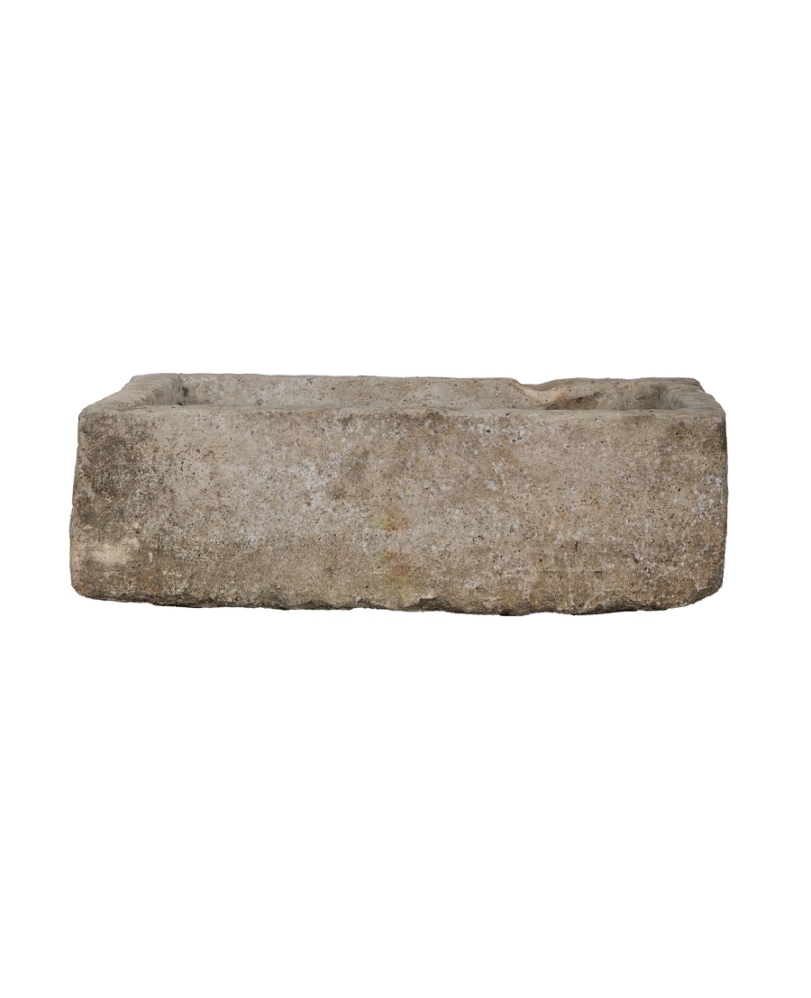 Vintage Indonesian rectangular limestone trough, full-length side view highlighting textured, weathered surface condition.