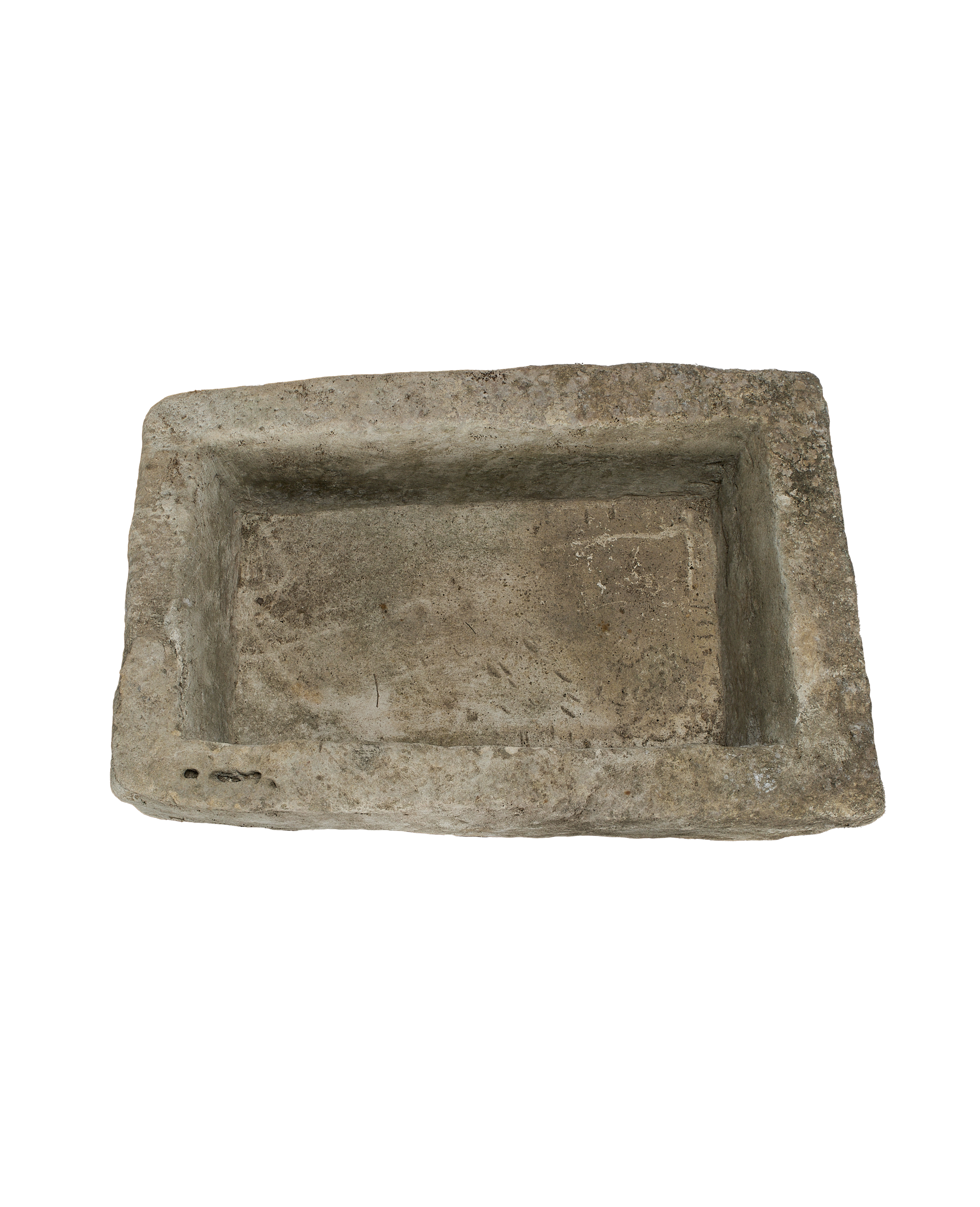 Vintage Indonesian limestone trough viewed from top, highlighting rustic texture and original drainage holes.