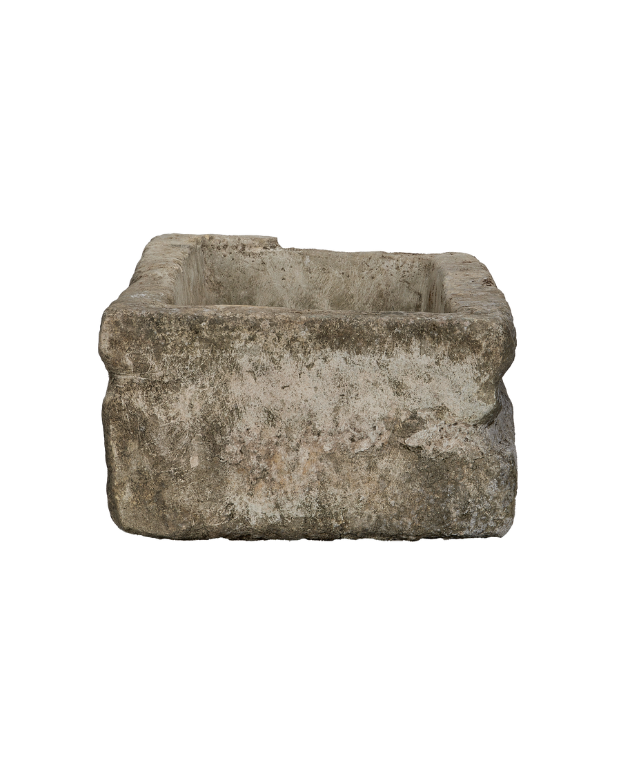 Vintage rectangular Indonesian limestone trough, top-down view highlighting weathered texture and rough-hewn edges.