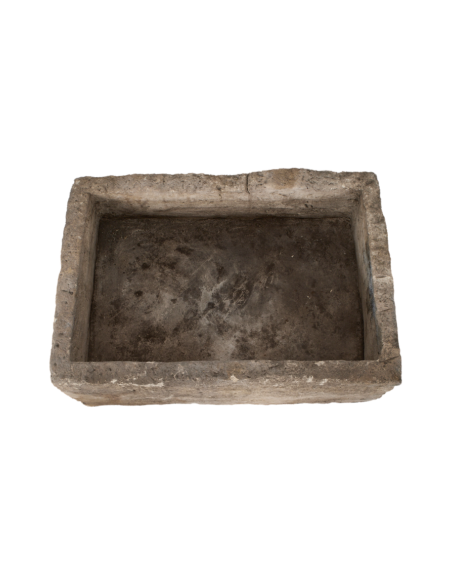 Vintage Indonesian rectangular limestone trough, top-down view showing interior and weathered texture.