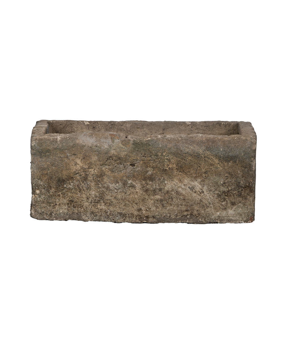 Vintage Indonesian rectangular limestone trough, side view revealing rustic texture and patina.