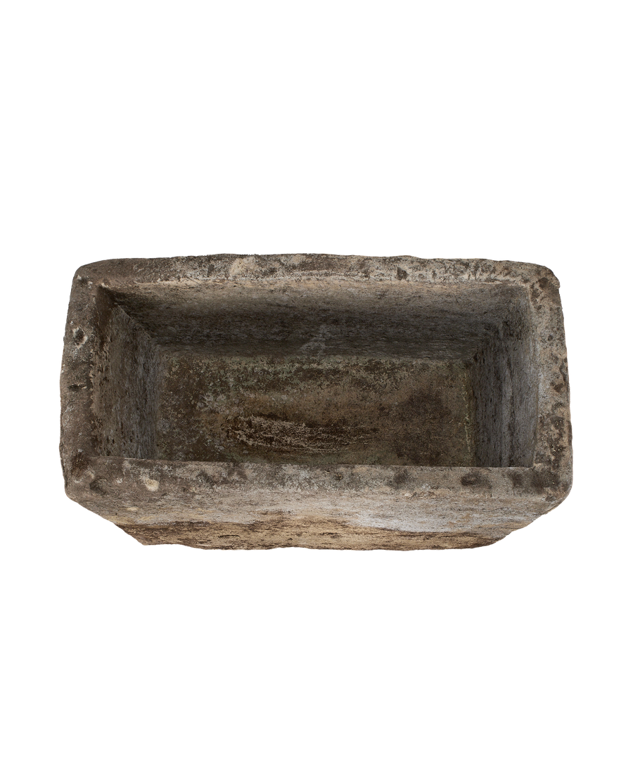 Vintage Indian limestone trough, rectangular, deeply weathered top-down view.