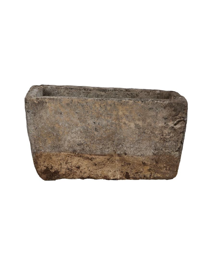 Vintage Indonesian rectangular limestone trough, front view showing weathered light brown and gray stone.