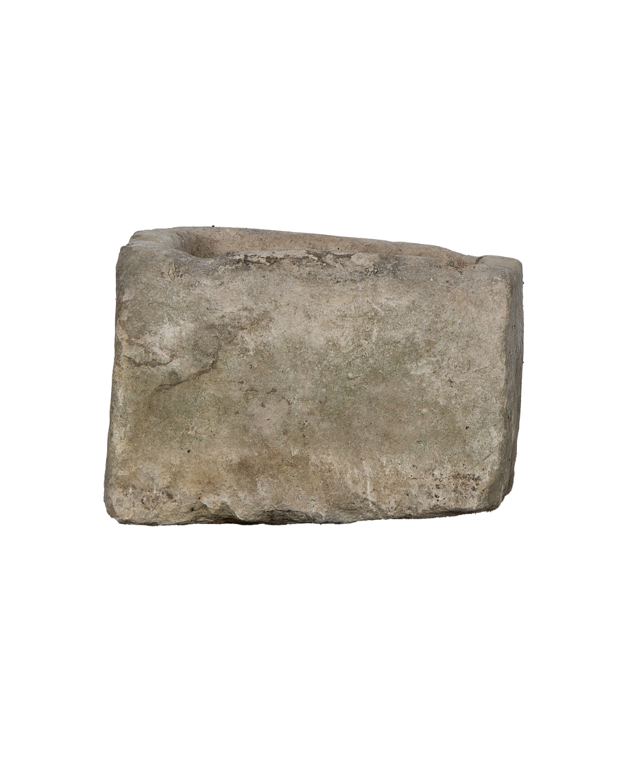 Vintage Indonesian rectangular limestone trough, rustic texture, dark top edge, straight-on view.