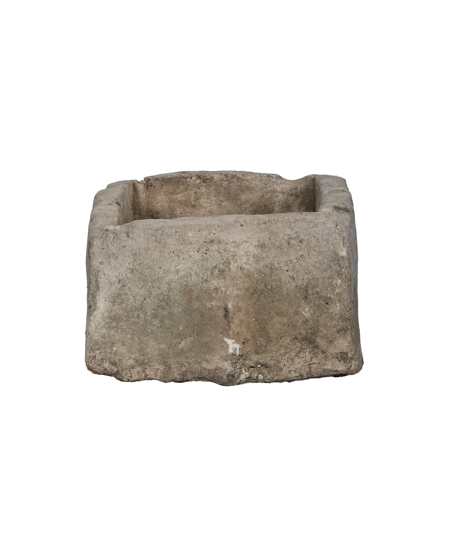 Vintage Indonesian rectangular limestone trough, bottom-level view highlights natural weathering and rough texture.