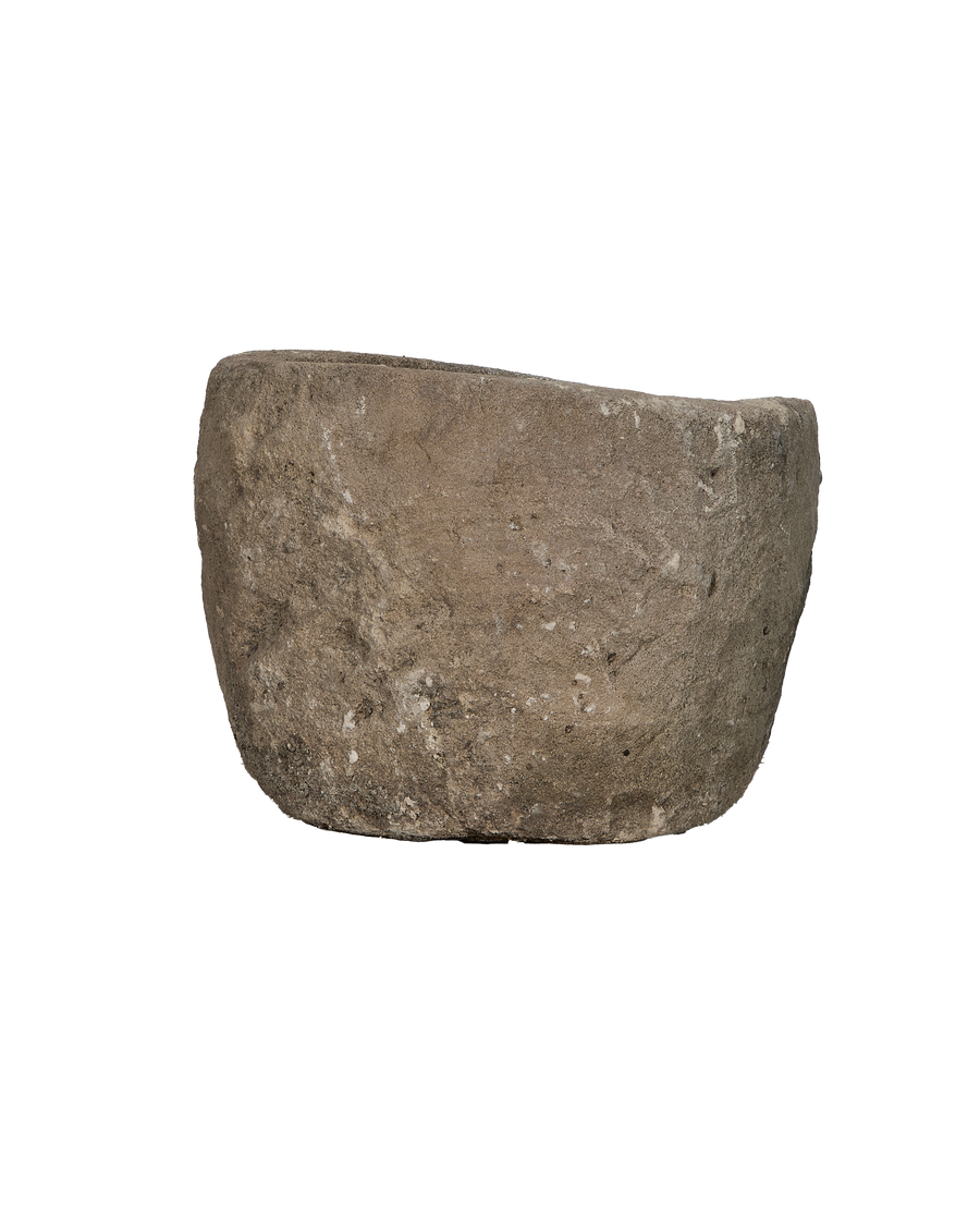 Vintage Indonesian limestone trough, side view, showcasing textured rustic finish.