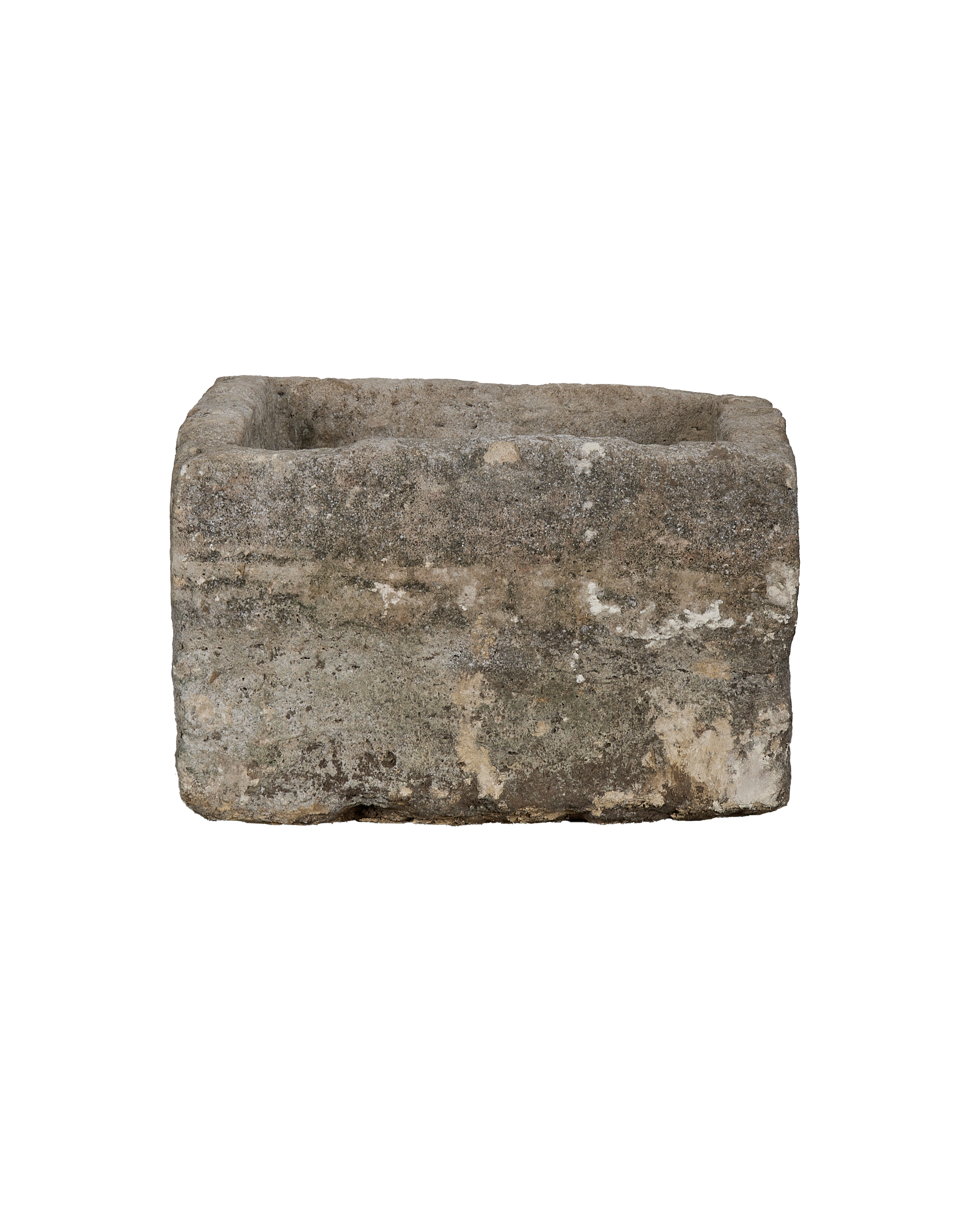 Vintage Indonesian rectangular limestone trough, close-up of rough weathered side texture.