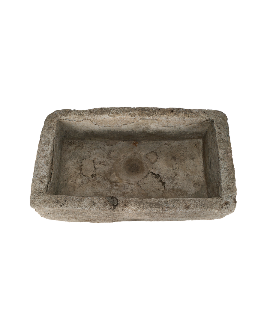 Vintage Indonesian rectangular limestone trough showing weathered, textured interior.