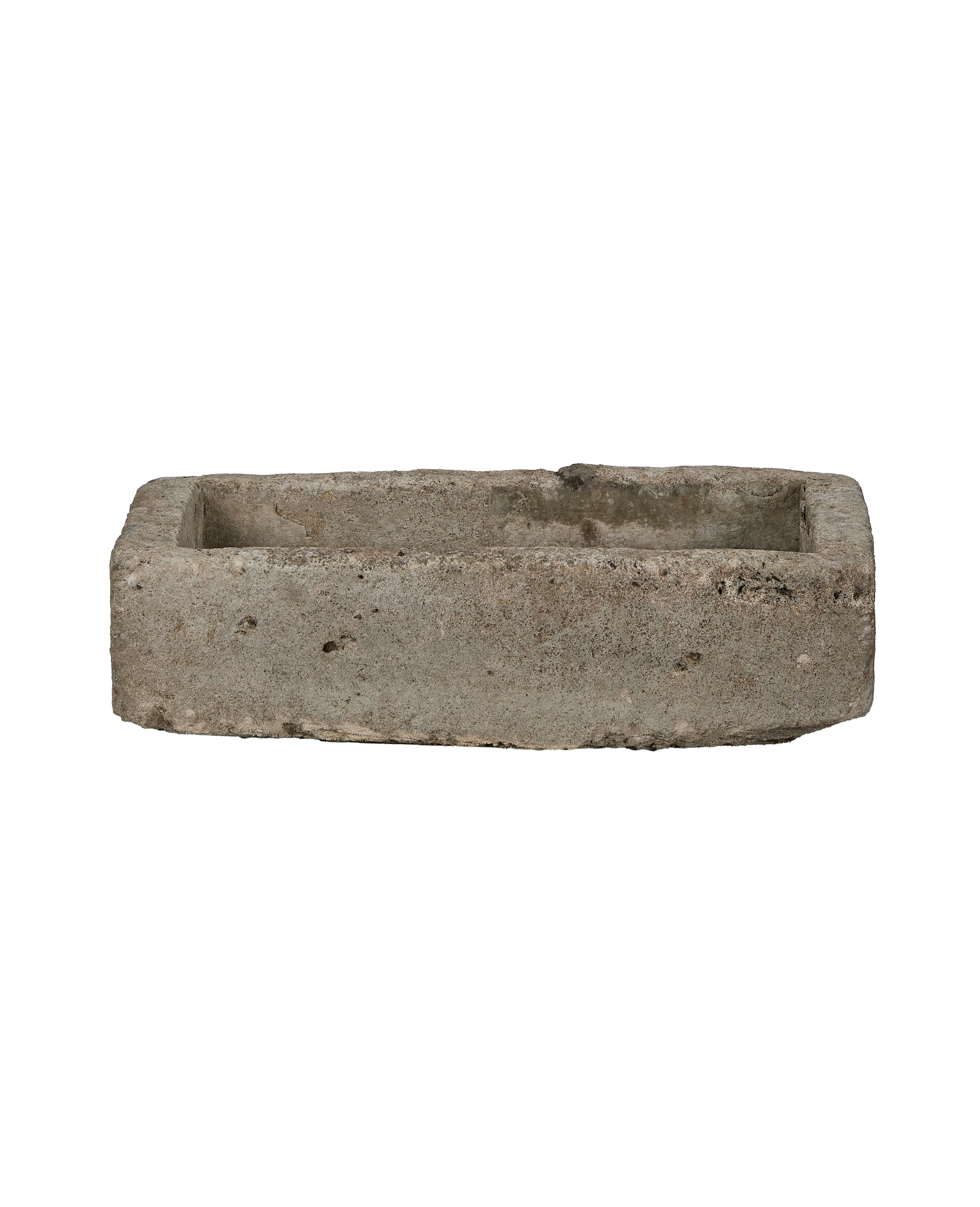 Vintage rectangular limestone trough, showing rough-hewn texture and aged surface.