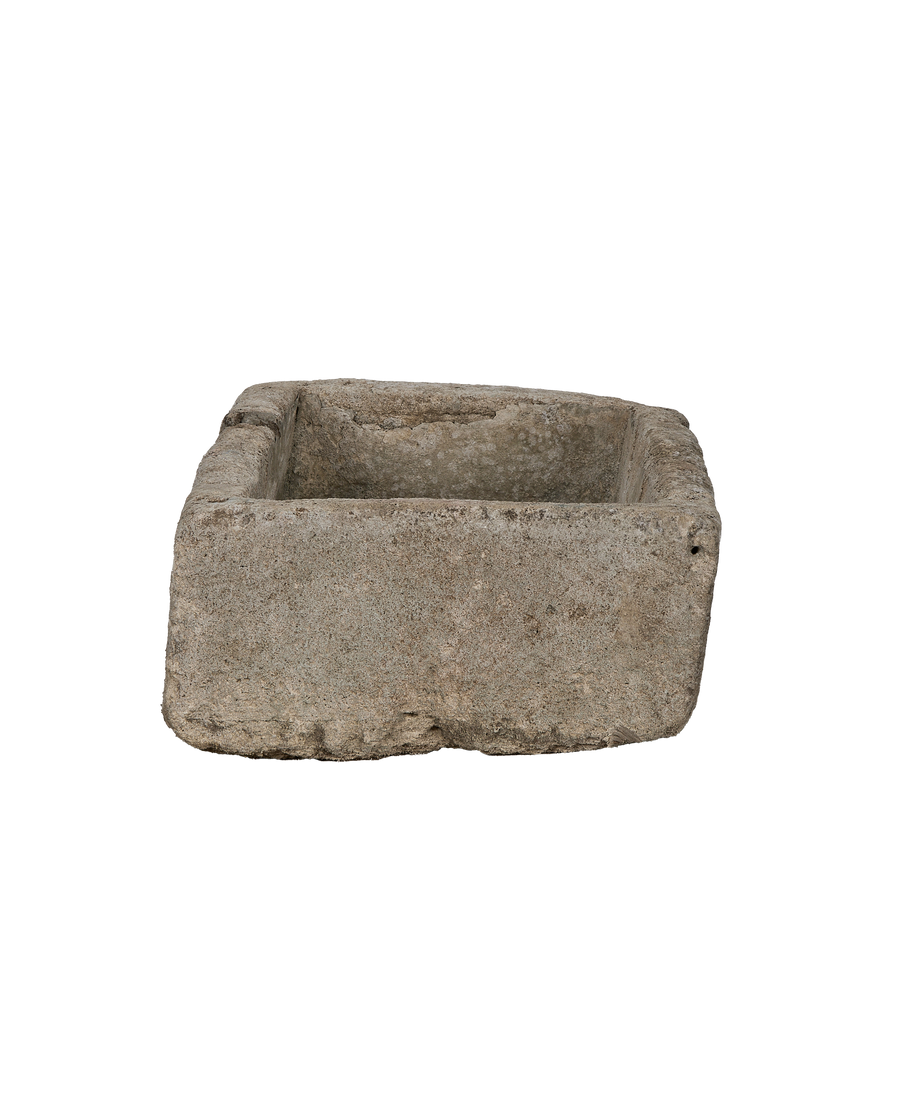 Vintage rectangular limestone trough from Indonesia with rugged, weathered interior texture.