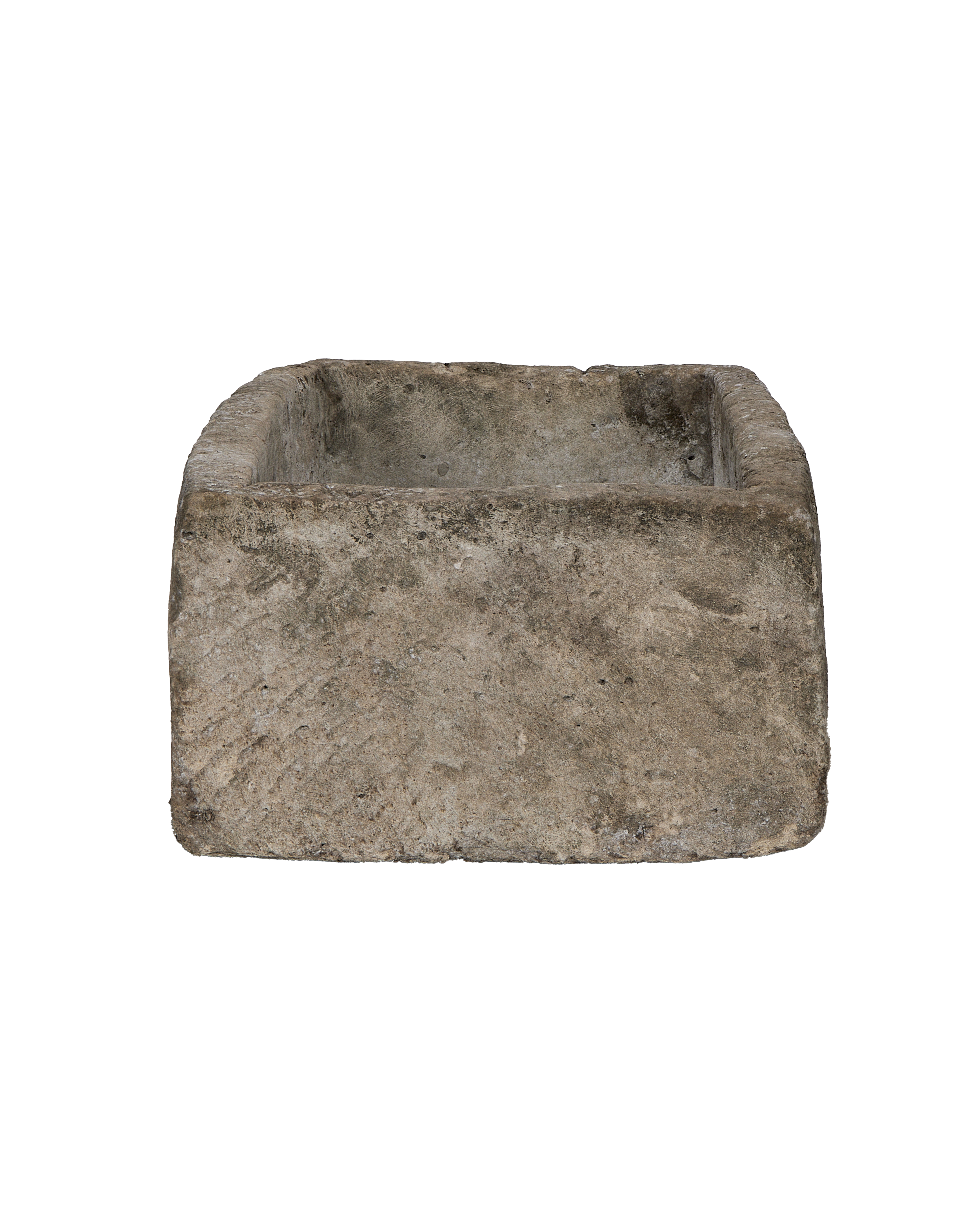 Vintage Indonesian limestone trough viewed from the front, showcasing weathered texture and rectangular shape.