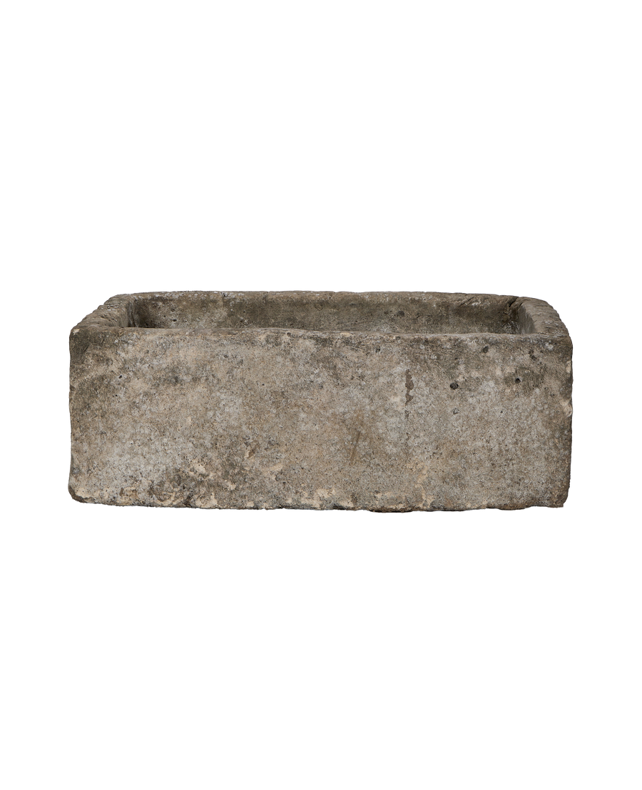 Vintage Indonesian limestone trough, top view highlighting rough texture and weathered condition.