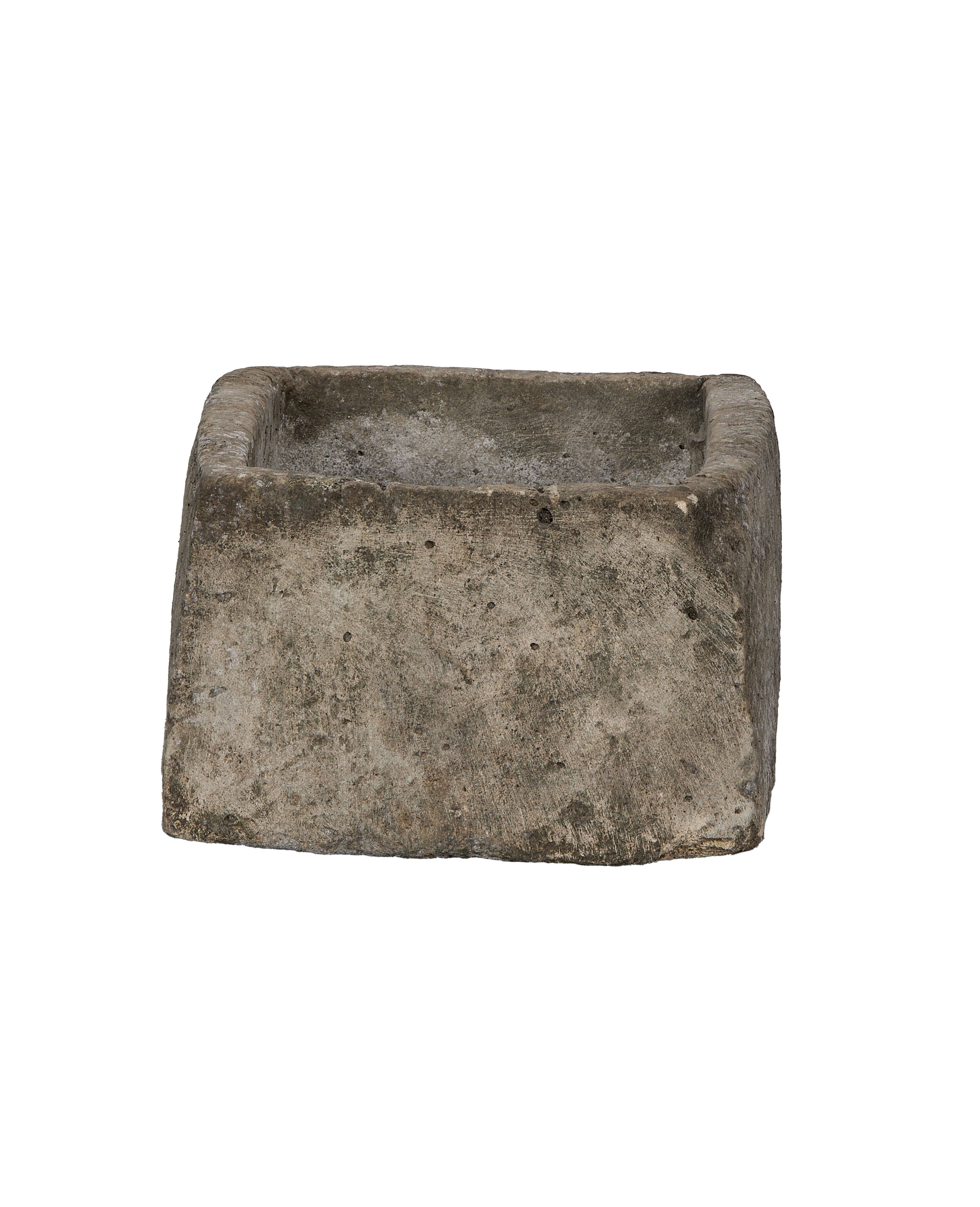 Vintage Indonesian limestone trough, OAK, showing rough weathered texture from side angle.