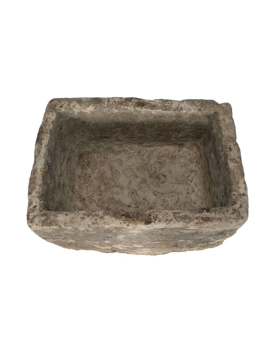 Vintage rectangular Indonesian limestone trough, top-down view showing interior texture.