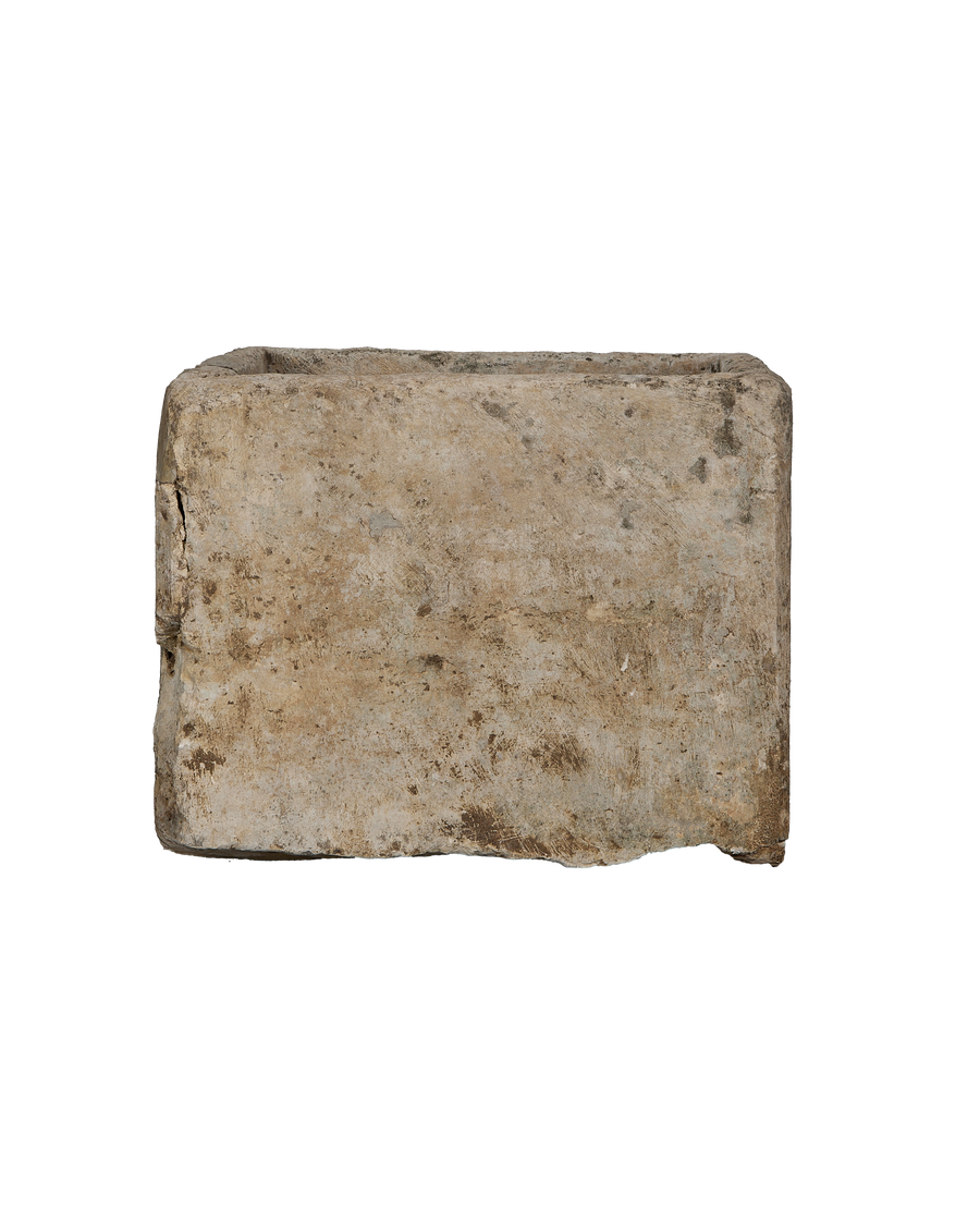Vintage Indonesian limestone trough, top-down view showing weathered texture and rectangular shape.
