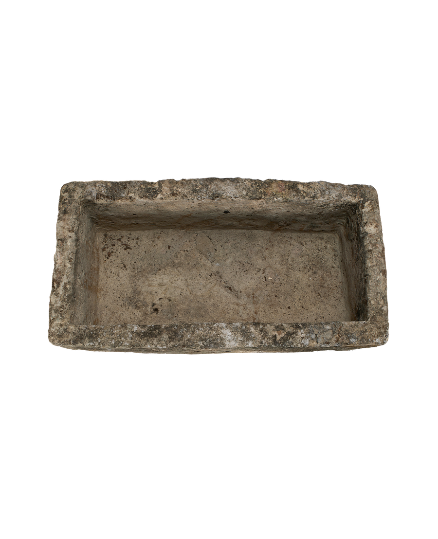Vintage rectangular Indonesian limestone trough with rough, aged interior and exterior texture from above.