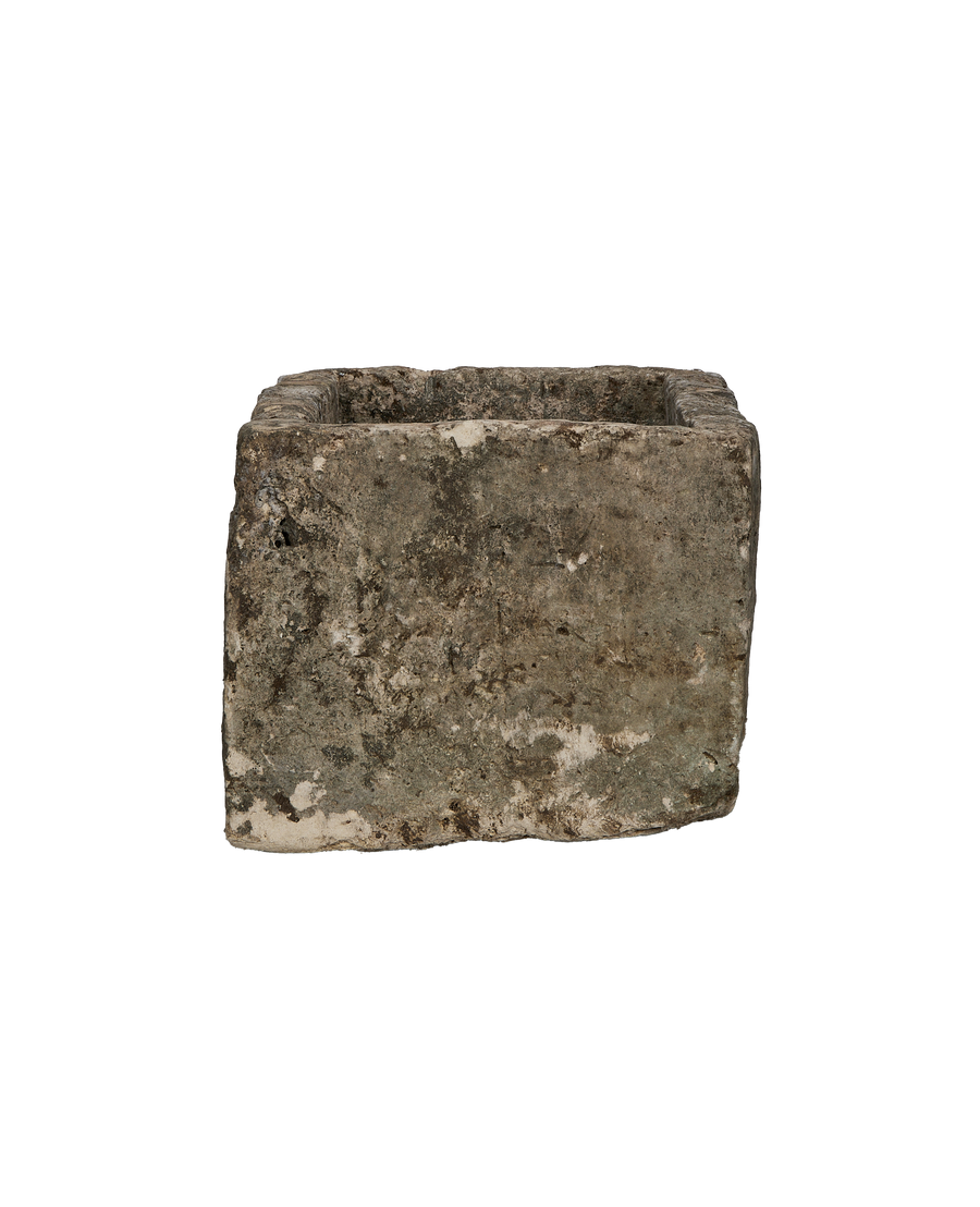Vintage rectangular limestone trough, side view, showing weathered, textured Indonesian stone.