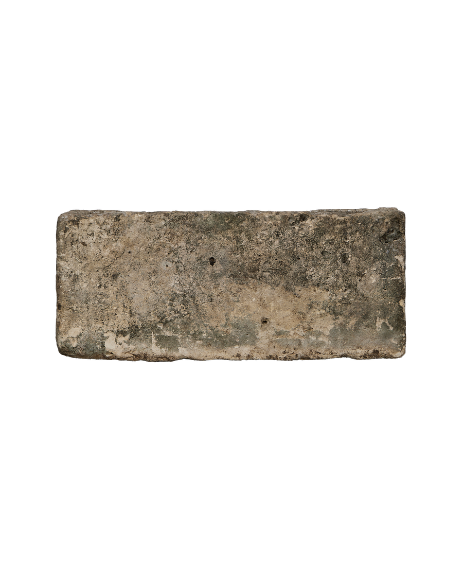 Vintage rectangular limestone trough, showing weathered texture with green and brown patina.