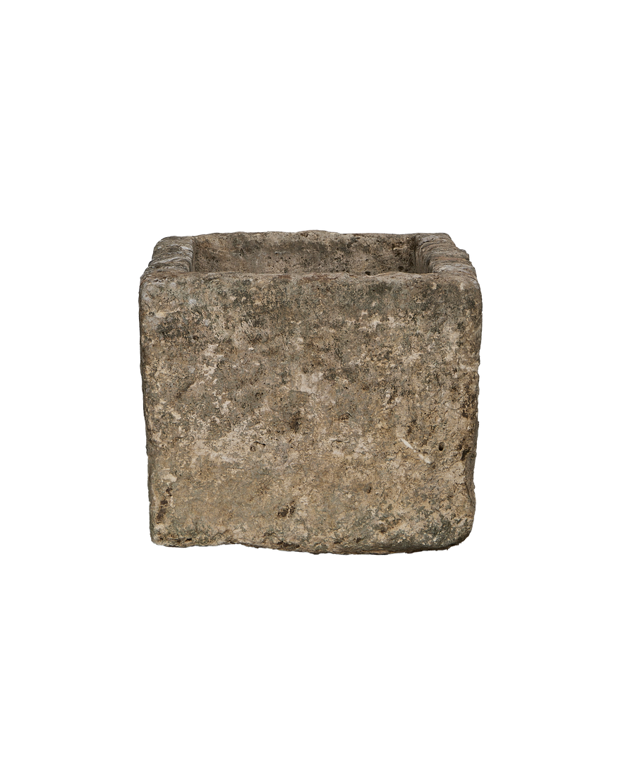 Vintage rectangular limestone trough, showing weathered texture from Indonesia, angled for detail.