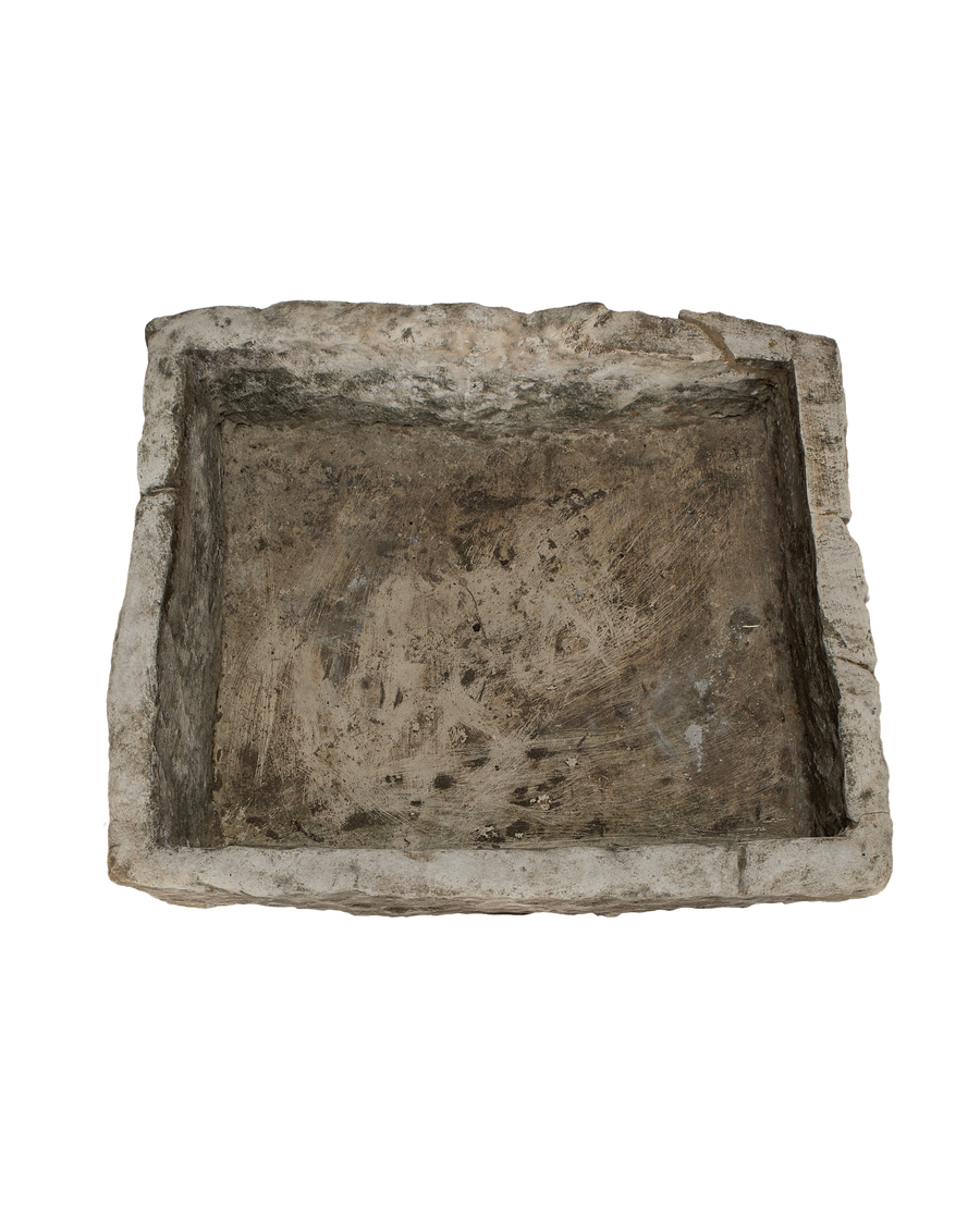 Vintage rectangular limestone trough, showing the rustic, textured interior with varied tones and worn surface.